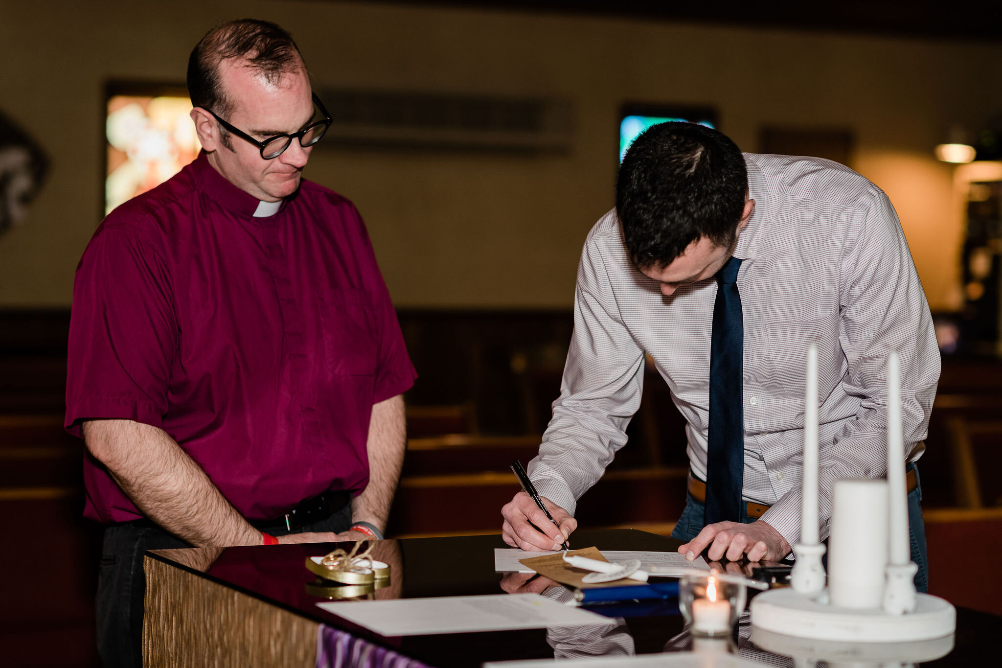 Witness signing marriage certificate