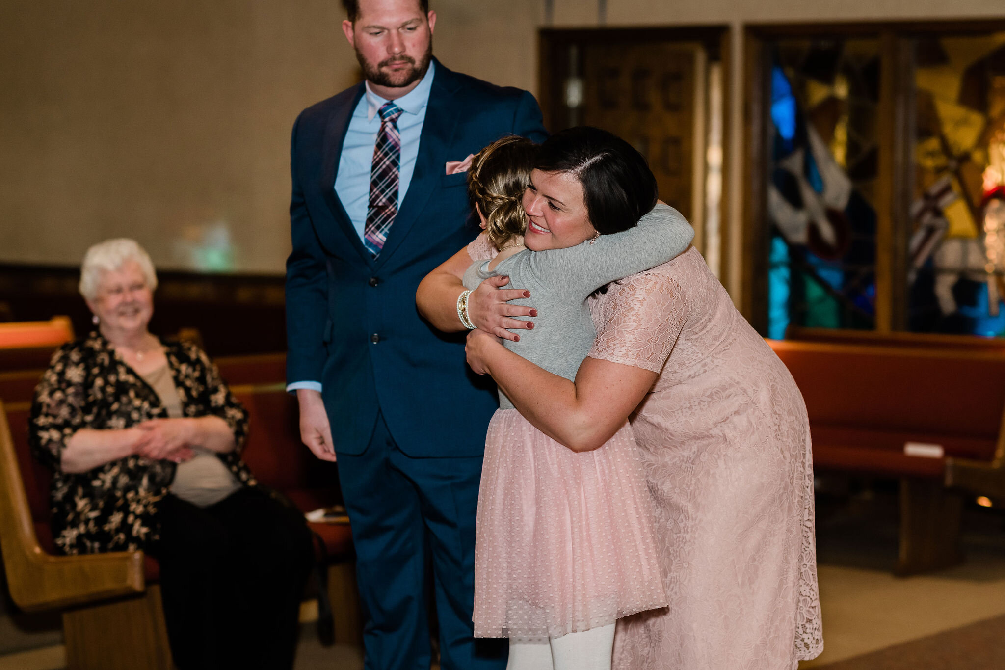 Bride hugging her new stepdaughter