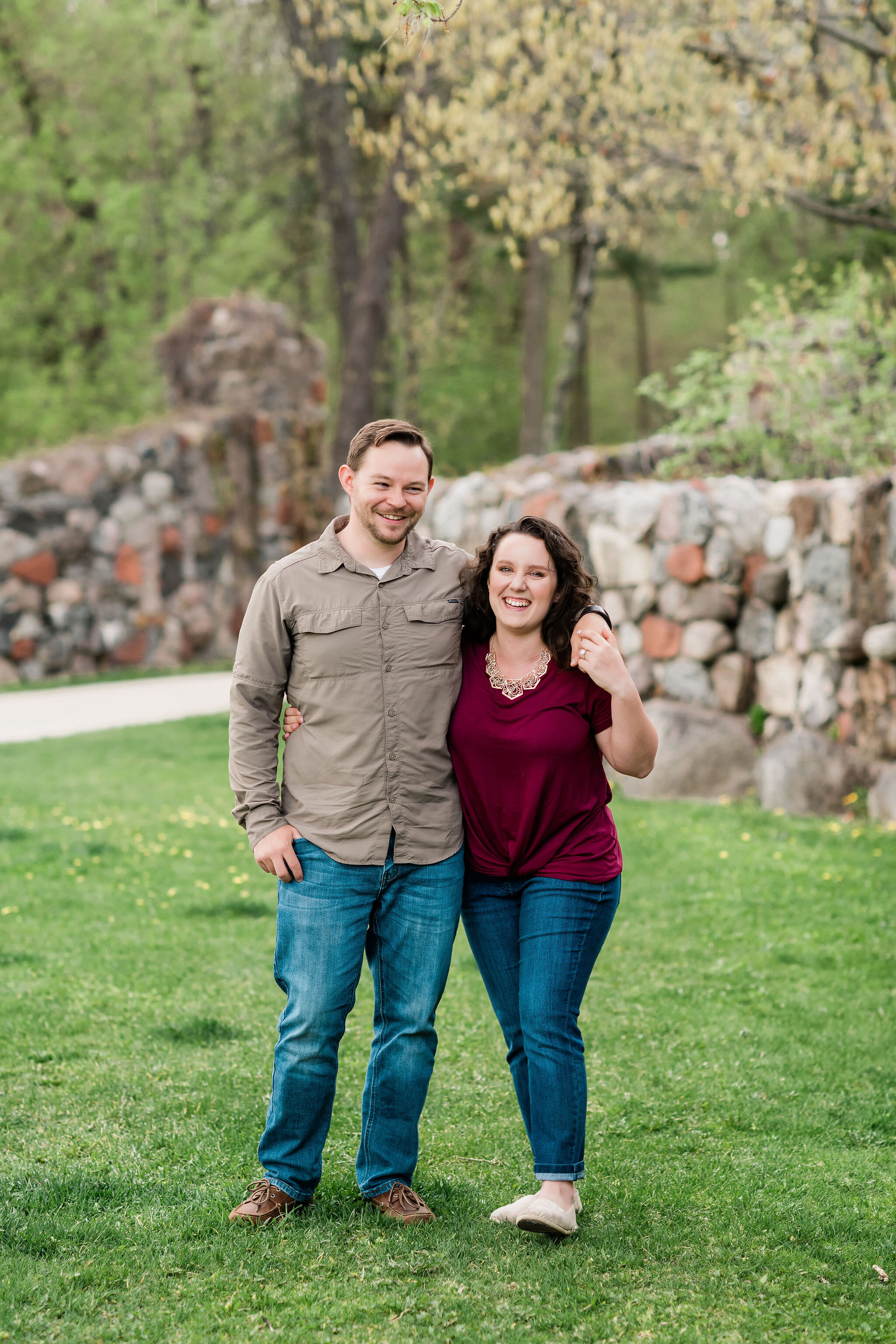 Engaged couple walking arm in arm