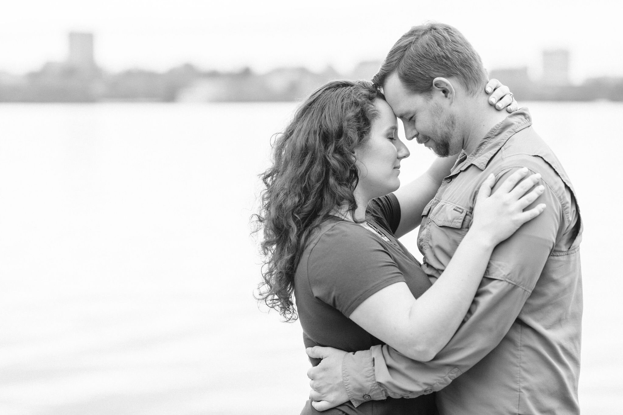 Engaged couple forehead to forehead