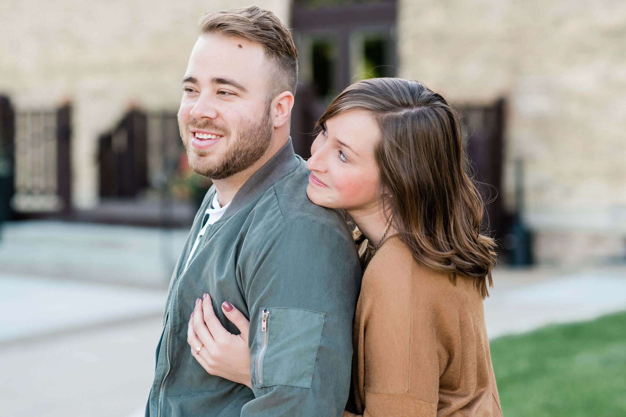 Woman gazes up at her fiancé