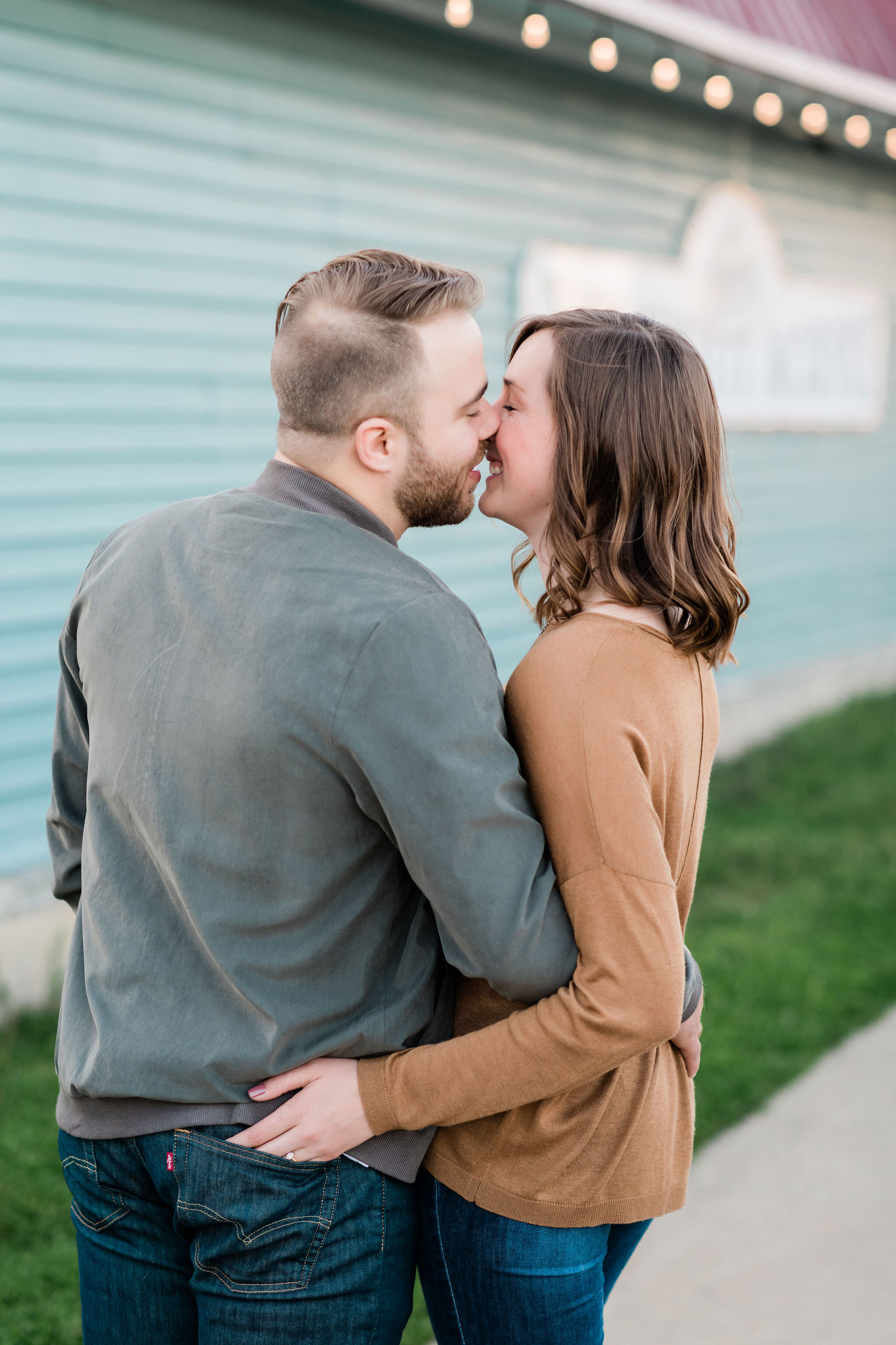 Engaged couple kissing