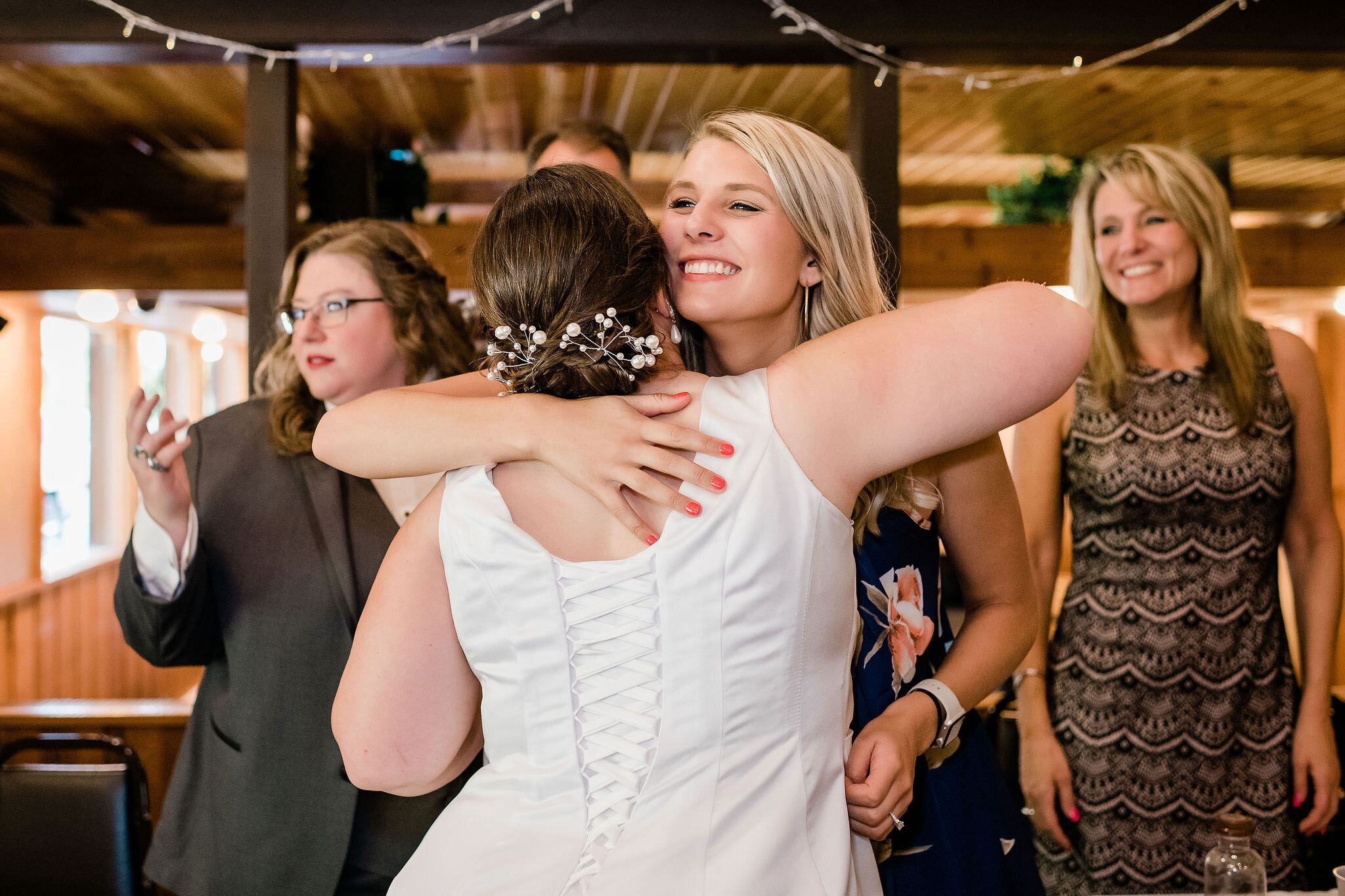 Bride hugging a wedding guest