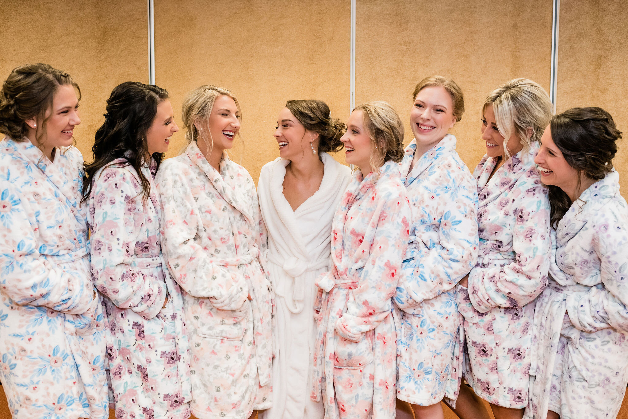 Bride and bridesmaids in floral robes