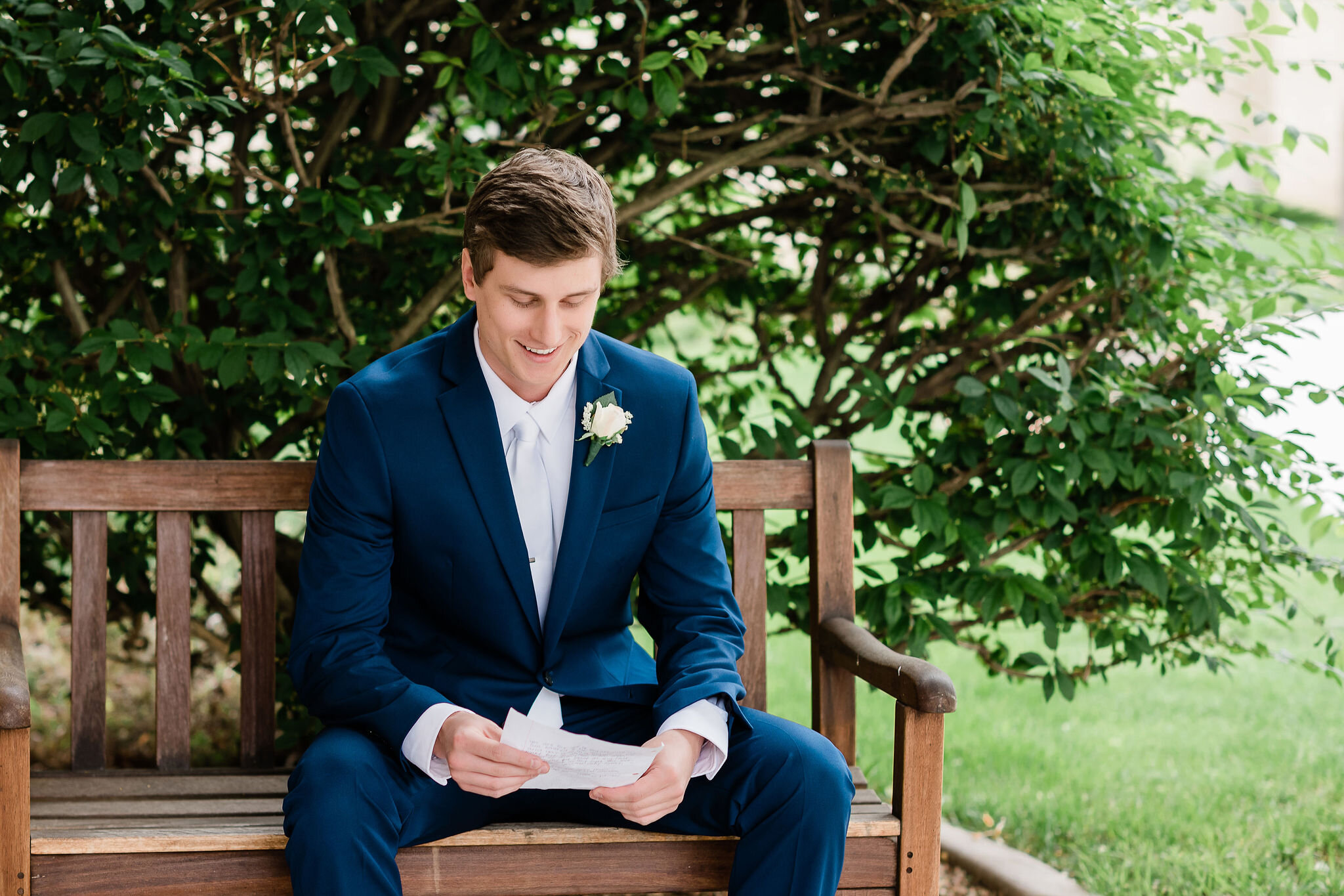 Groom reading a letter from his wife to be