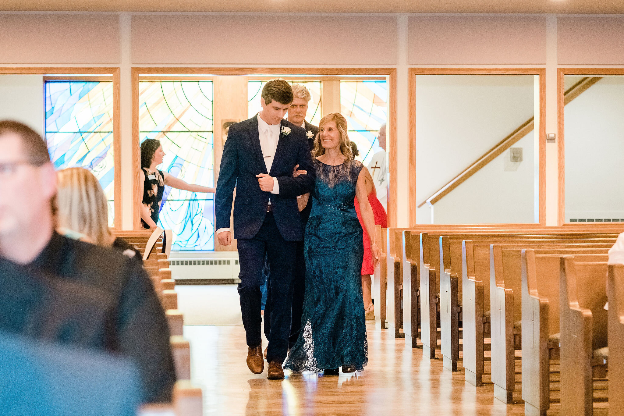 Groom walks his mother down the aisle