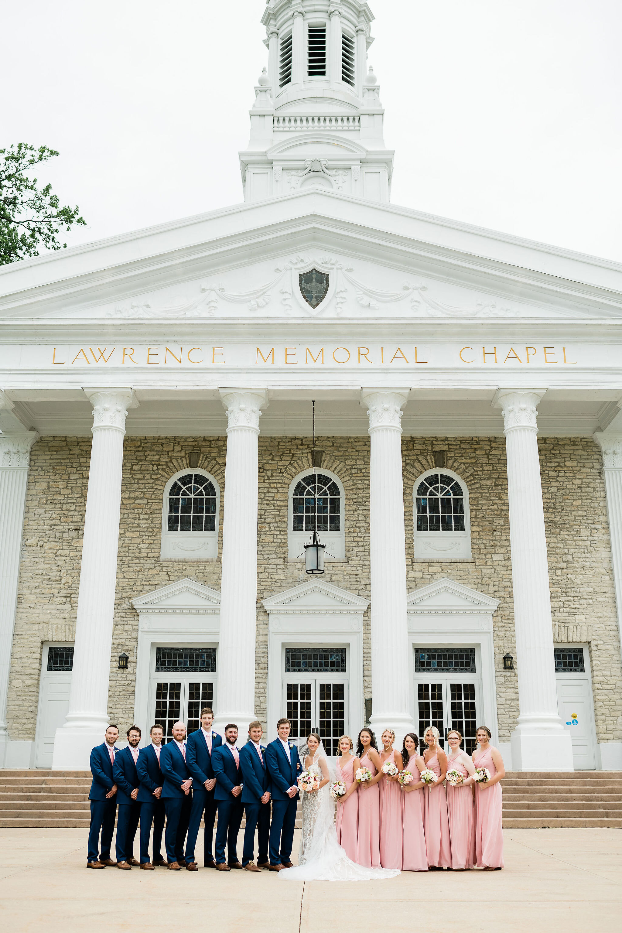 Wedding party in front of Lawrence Memorial Chapel in Appleton, WI