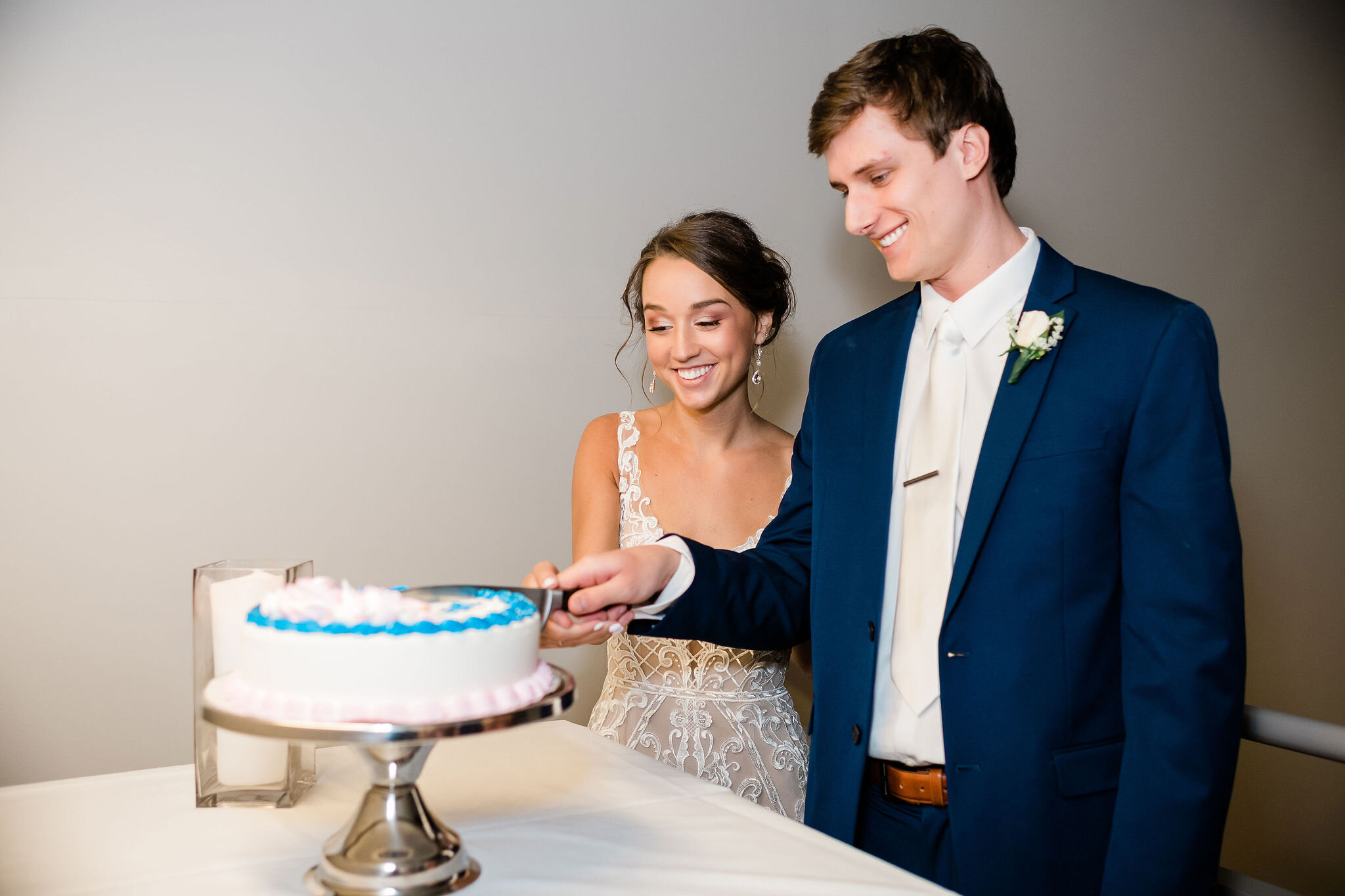 Bride and groom cutting Dairy Queen ice cream cake