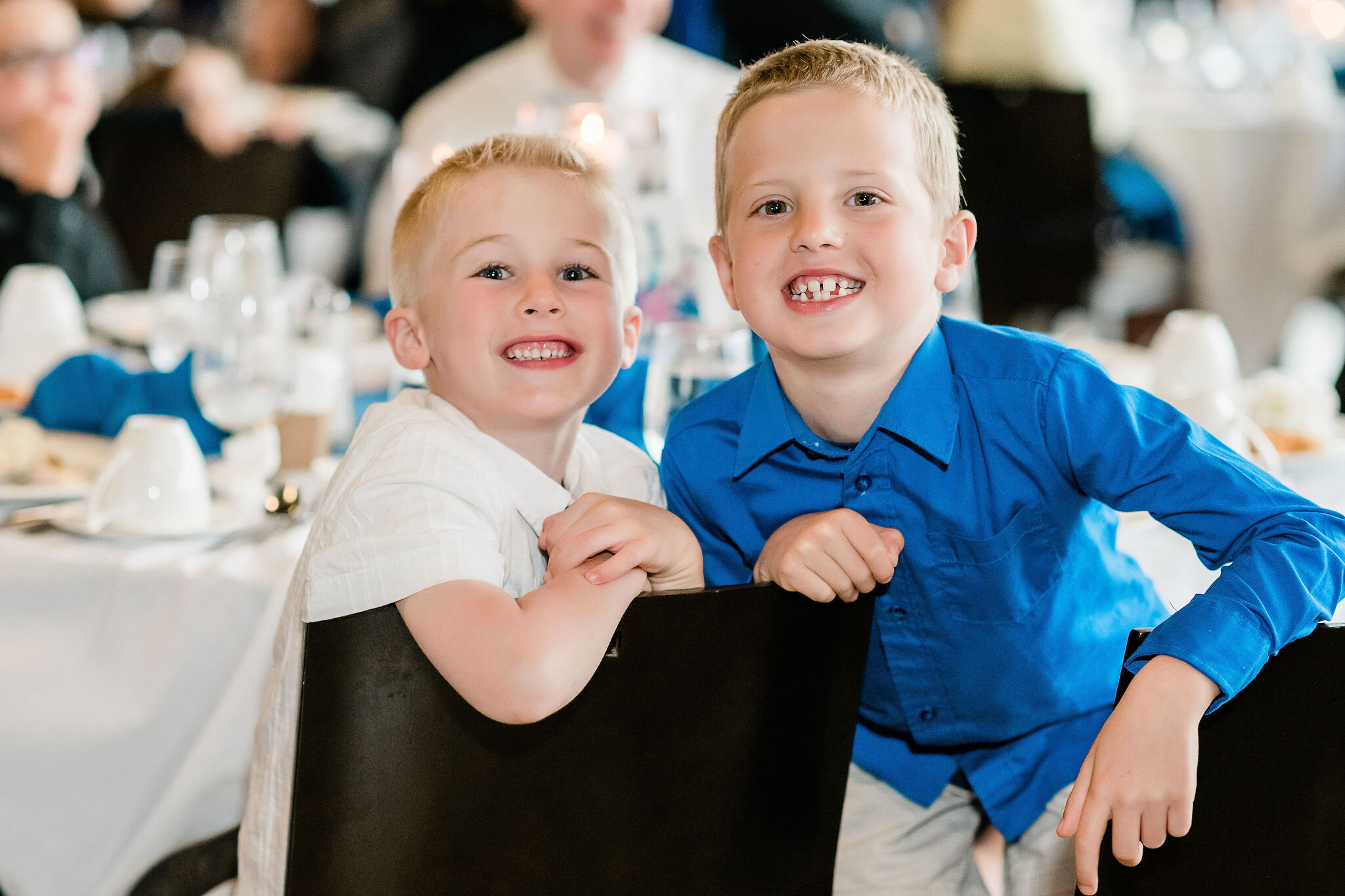 Children smiling for the camera at the wedding reception