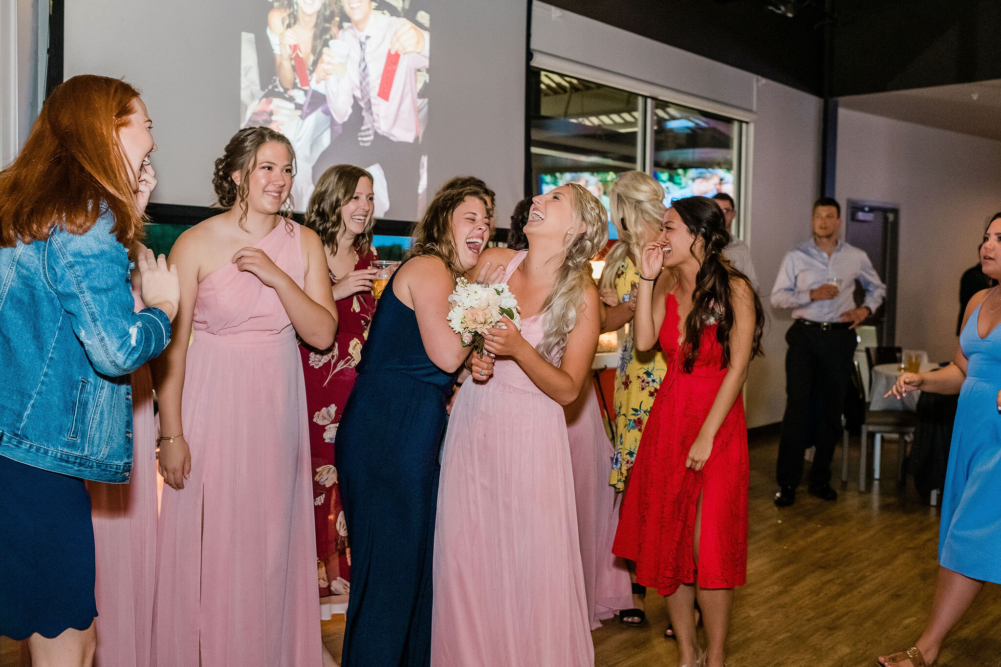 Bridesmaid catches the bride's bouquet