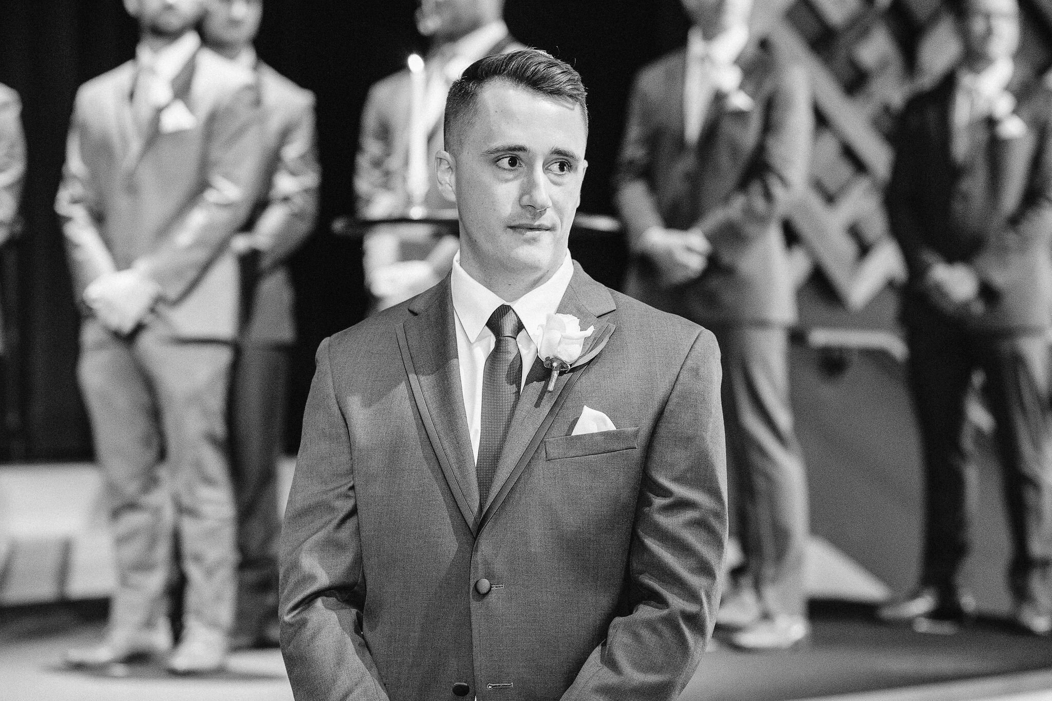 Groom waiting for bride to walk down the aisle