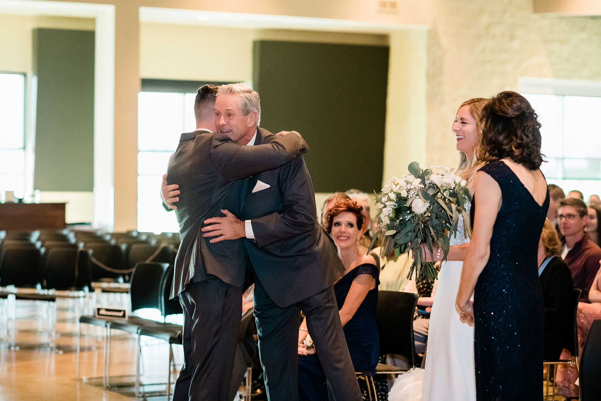 Groom hugging his father in law