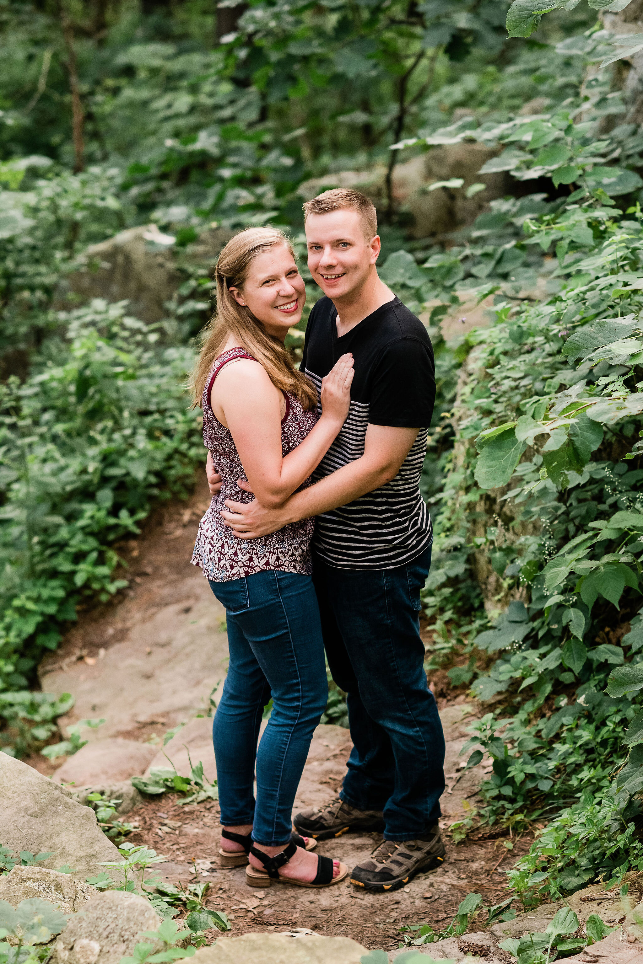 Engaged couple in the woods