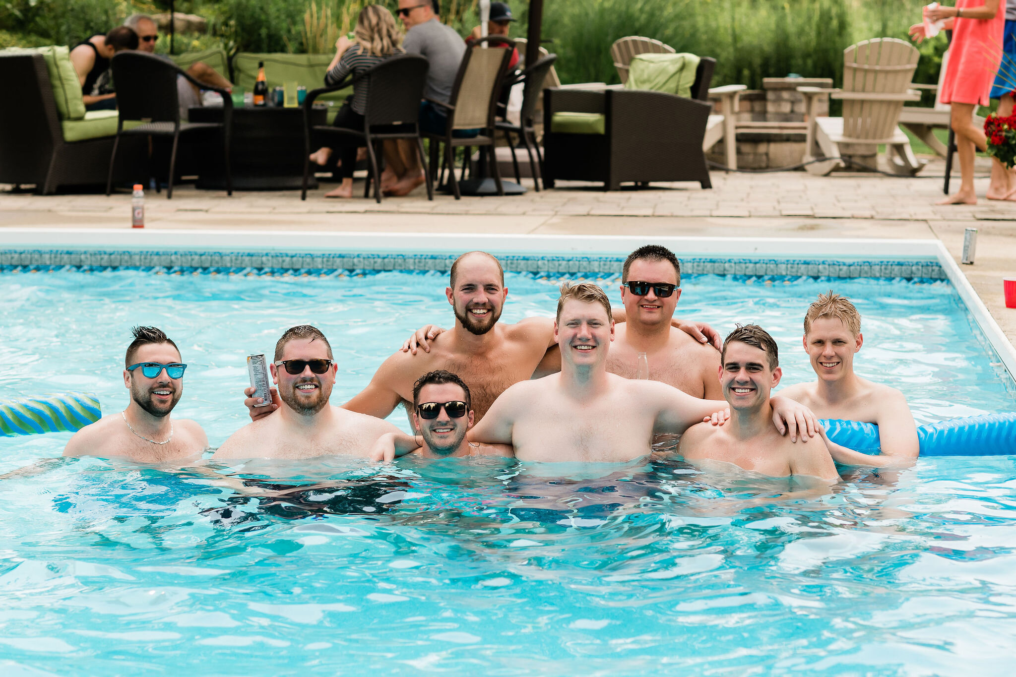 Groom and groomsmen in the pool