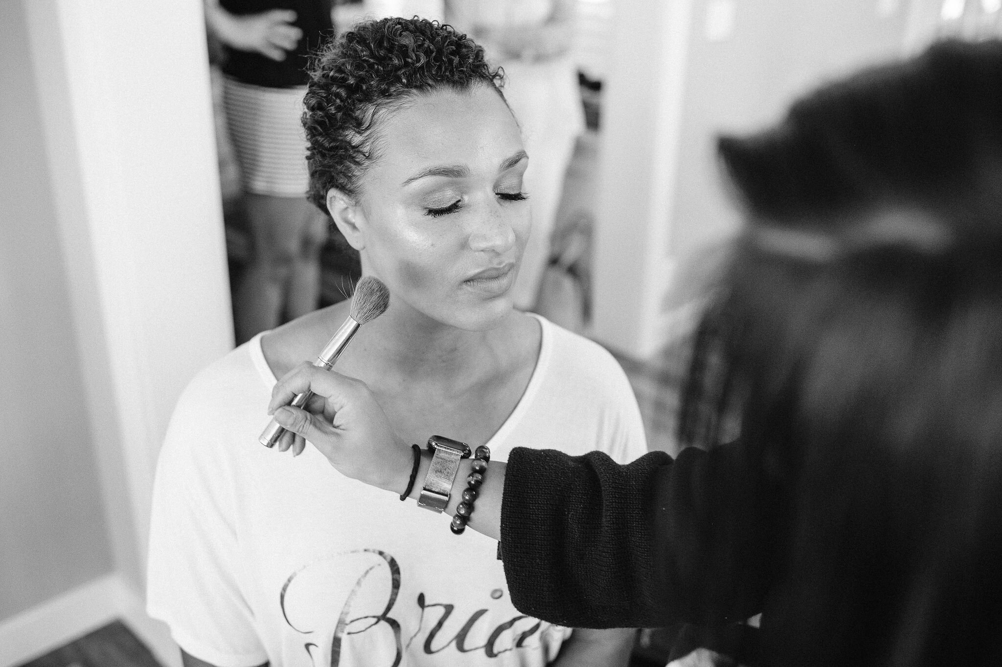 Bride getting makeup done