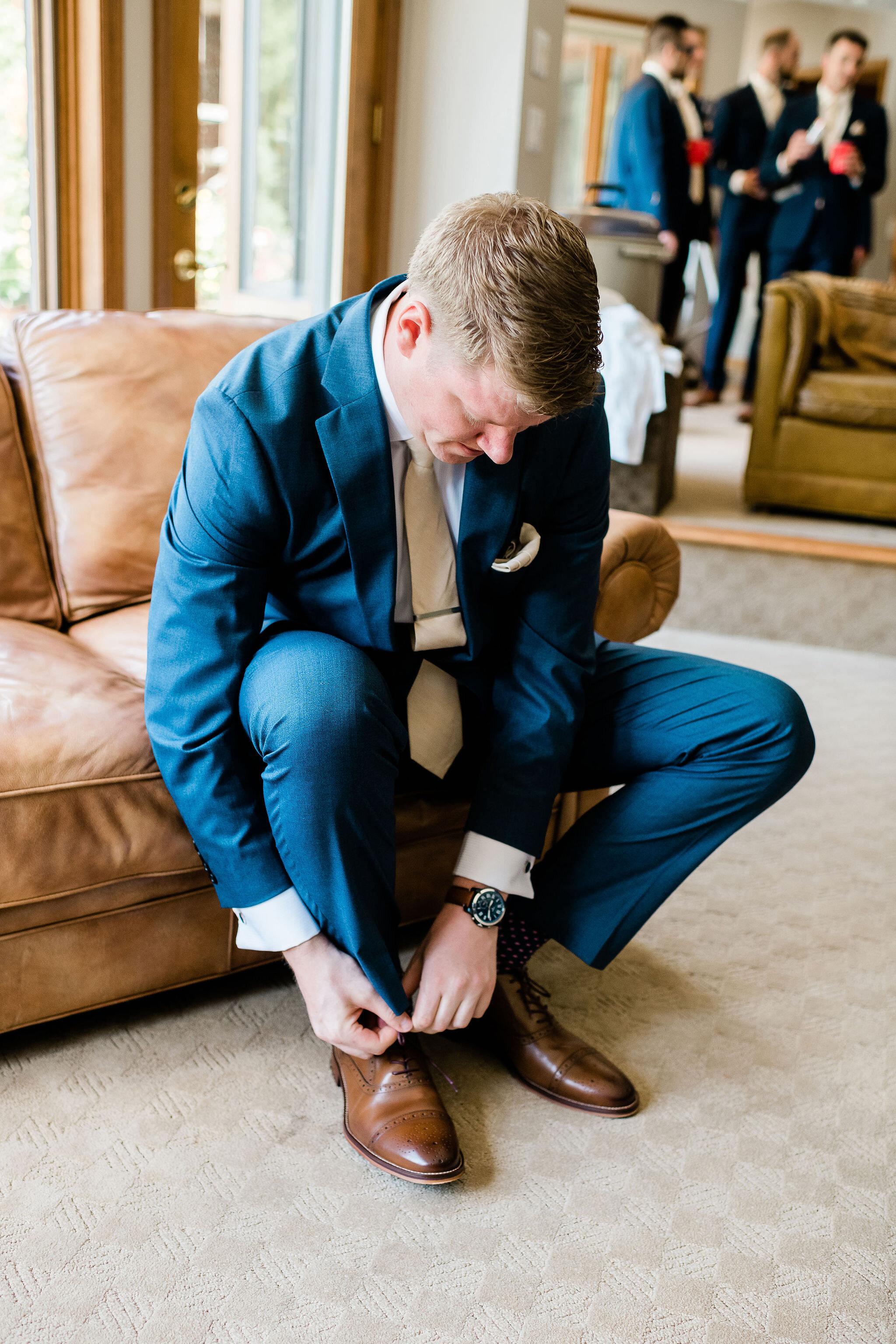 Groom putting on his shoes