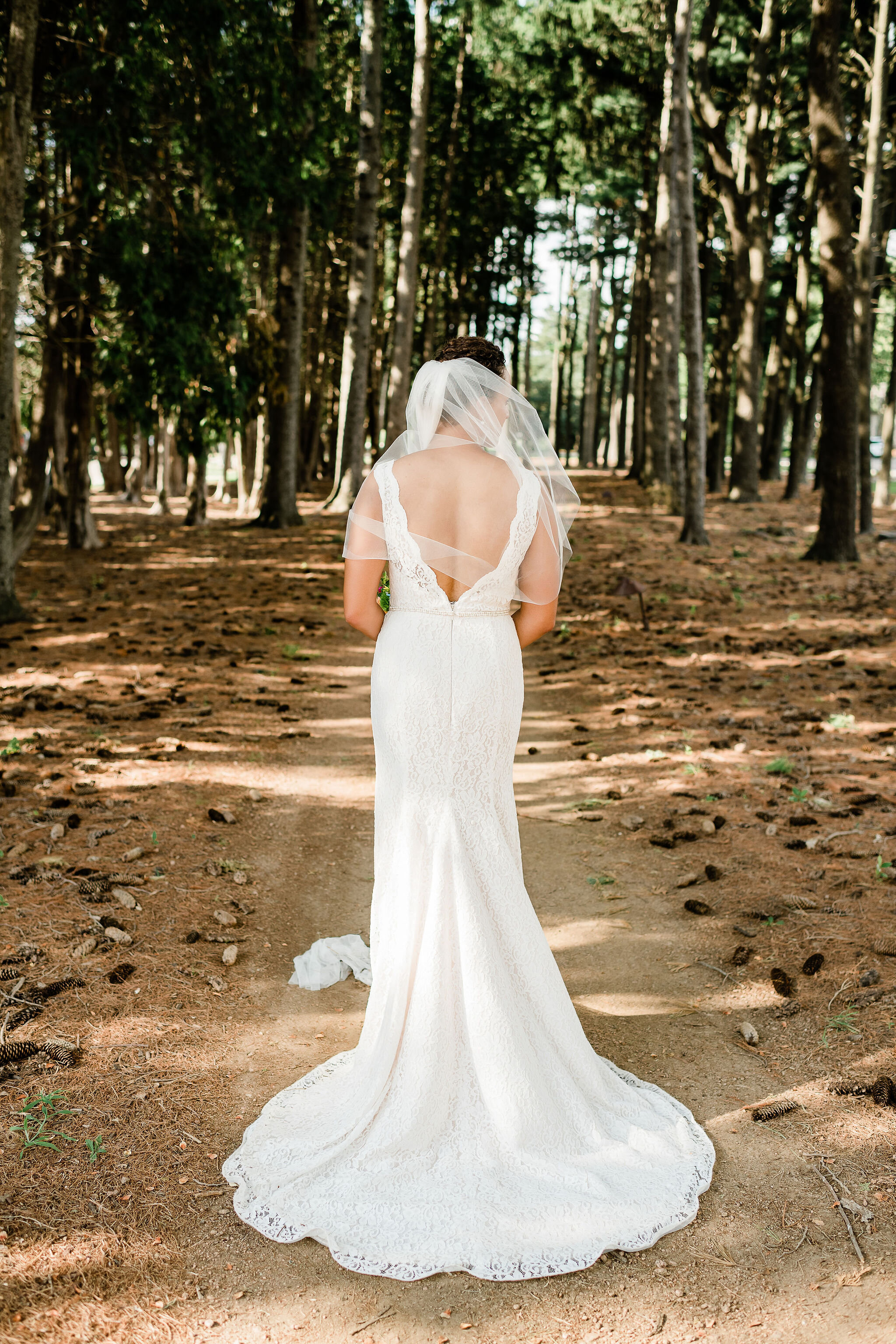 Back view of bride in the woods