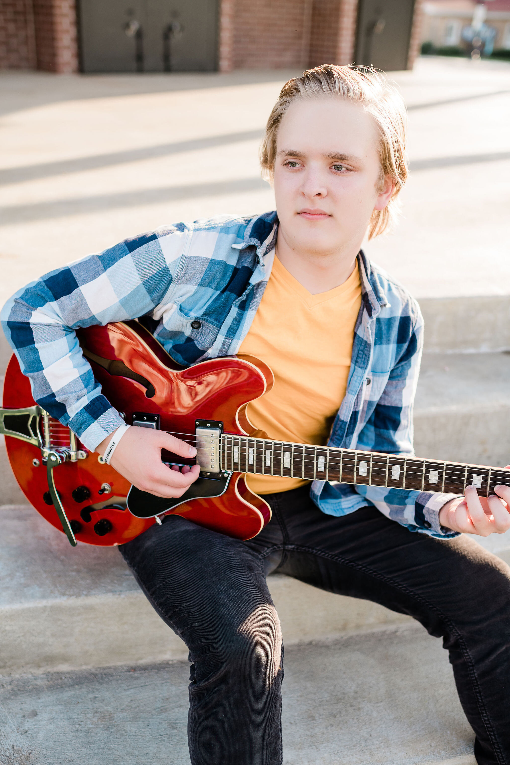 High school senior playing guitar