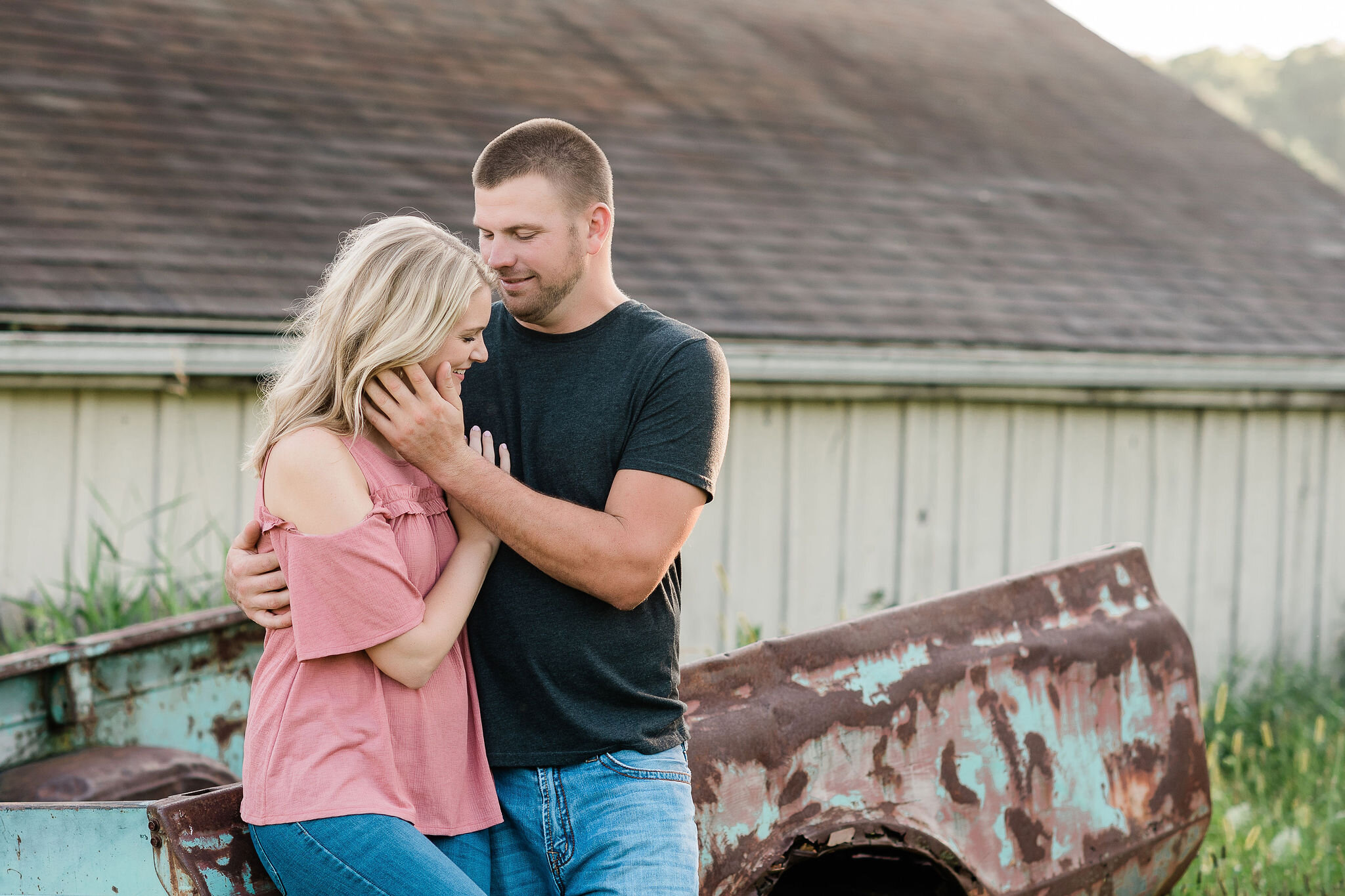 Man brushes his hand through his fiancé's hair