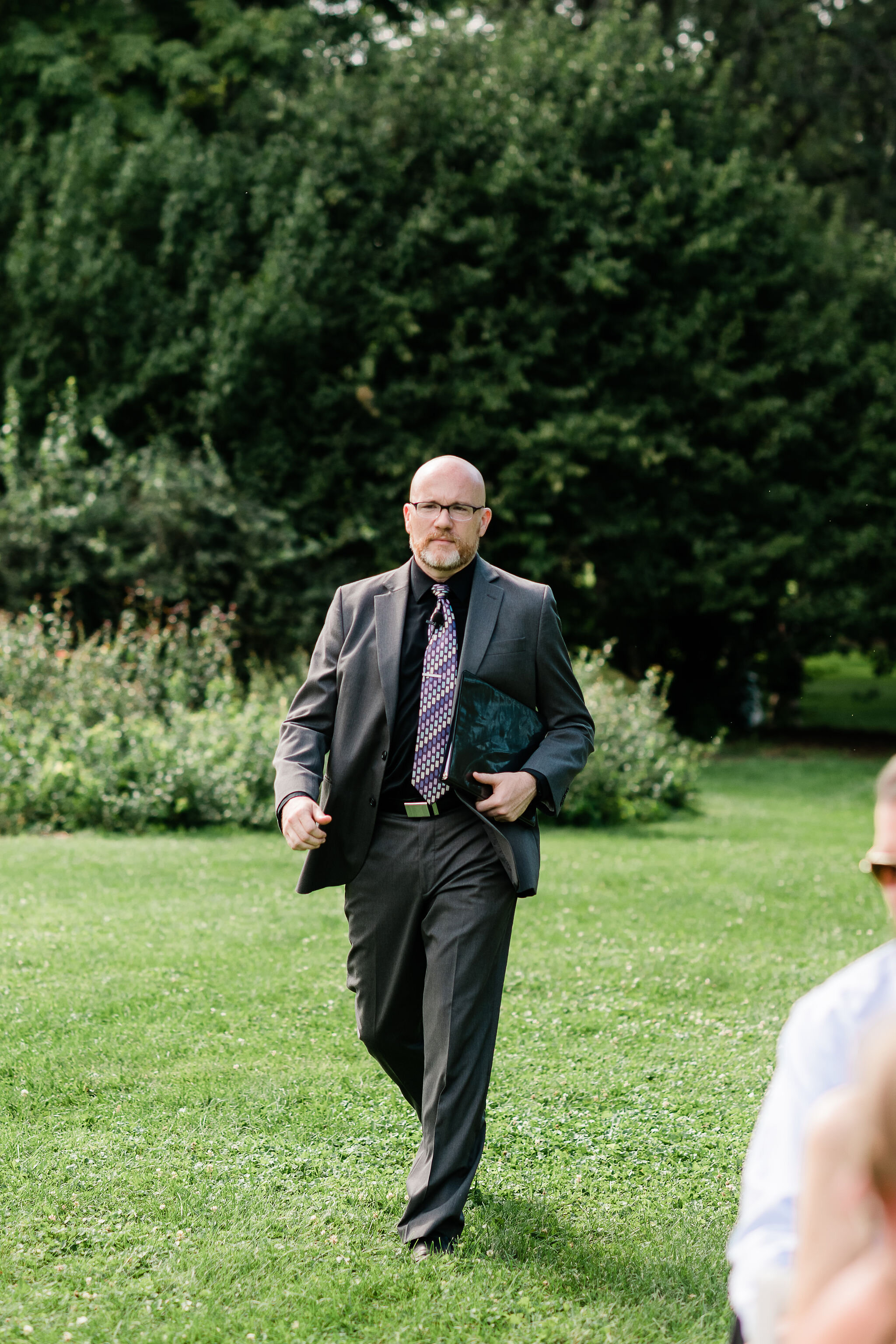 Officiant walking down the aisle