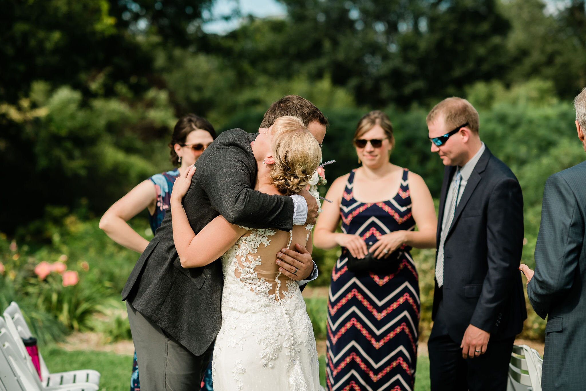 Bride hugging a wedding guest