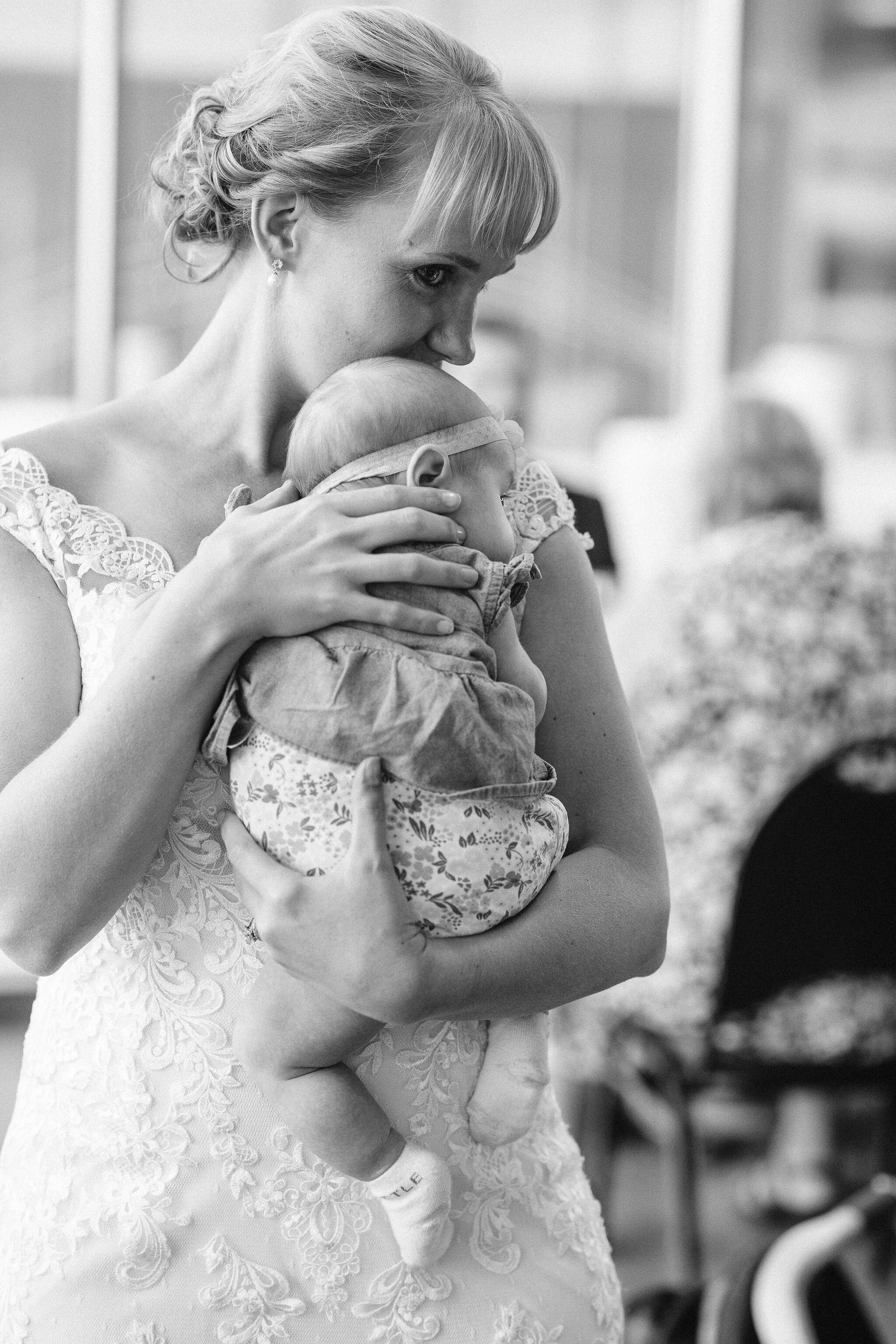 Bride holding a baby