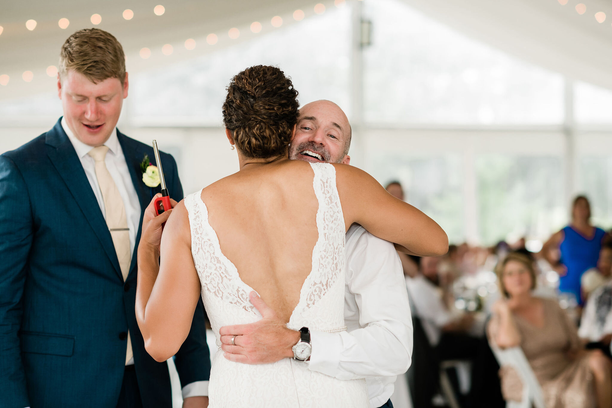 Bride hugging wedding guest