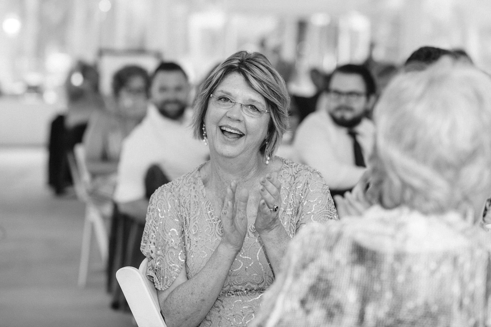 Mother of the groom clapping