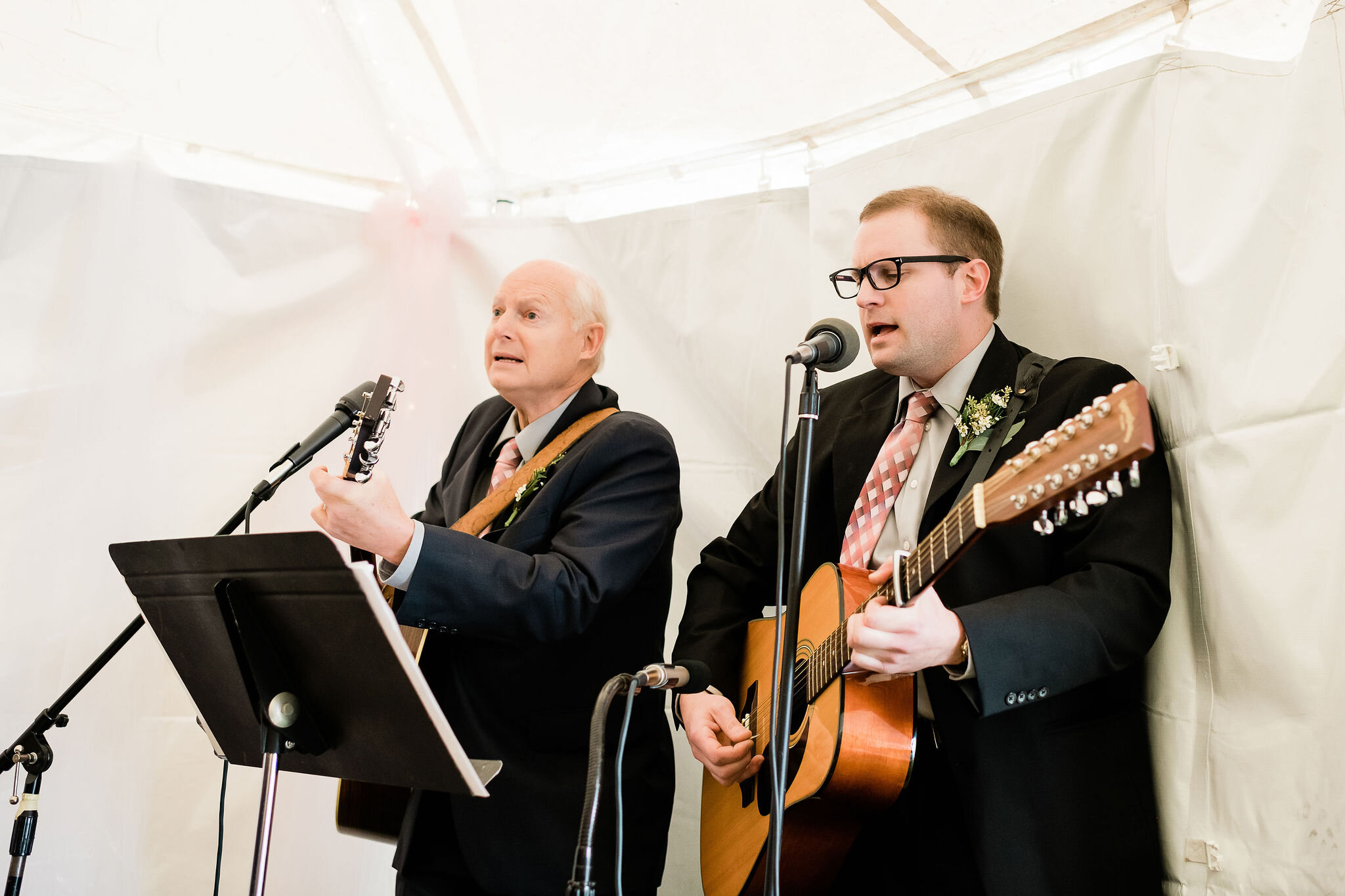Bride's father and brother singing and playing instruments