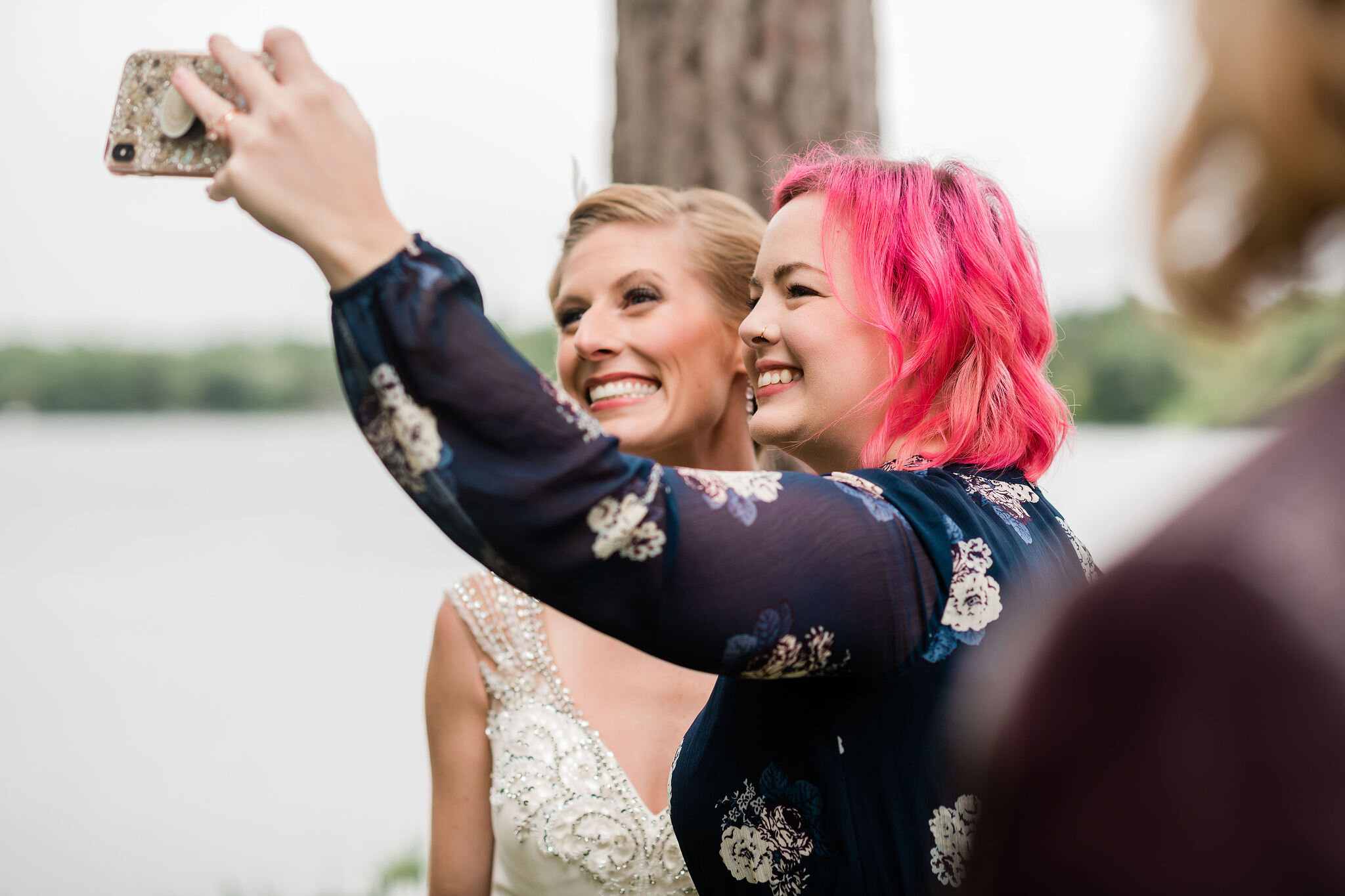 Bride and wedding guest taking a selfie