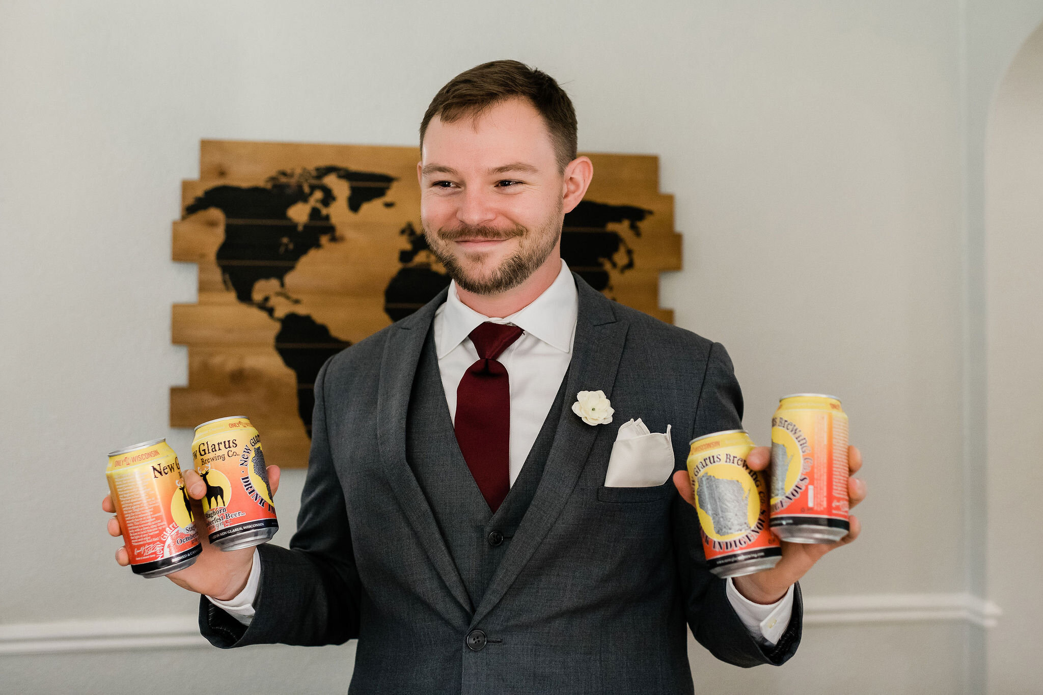 Groom with four beers in his hands