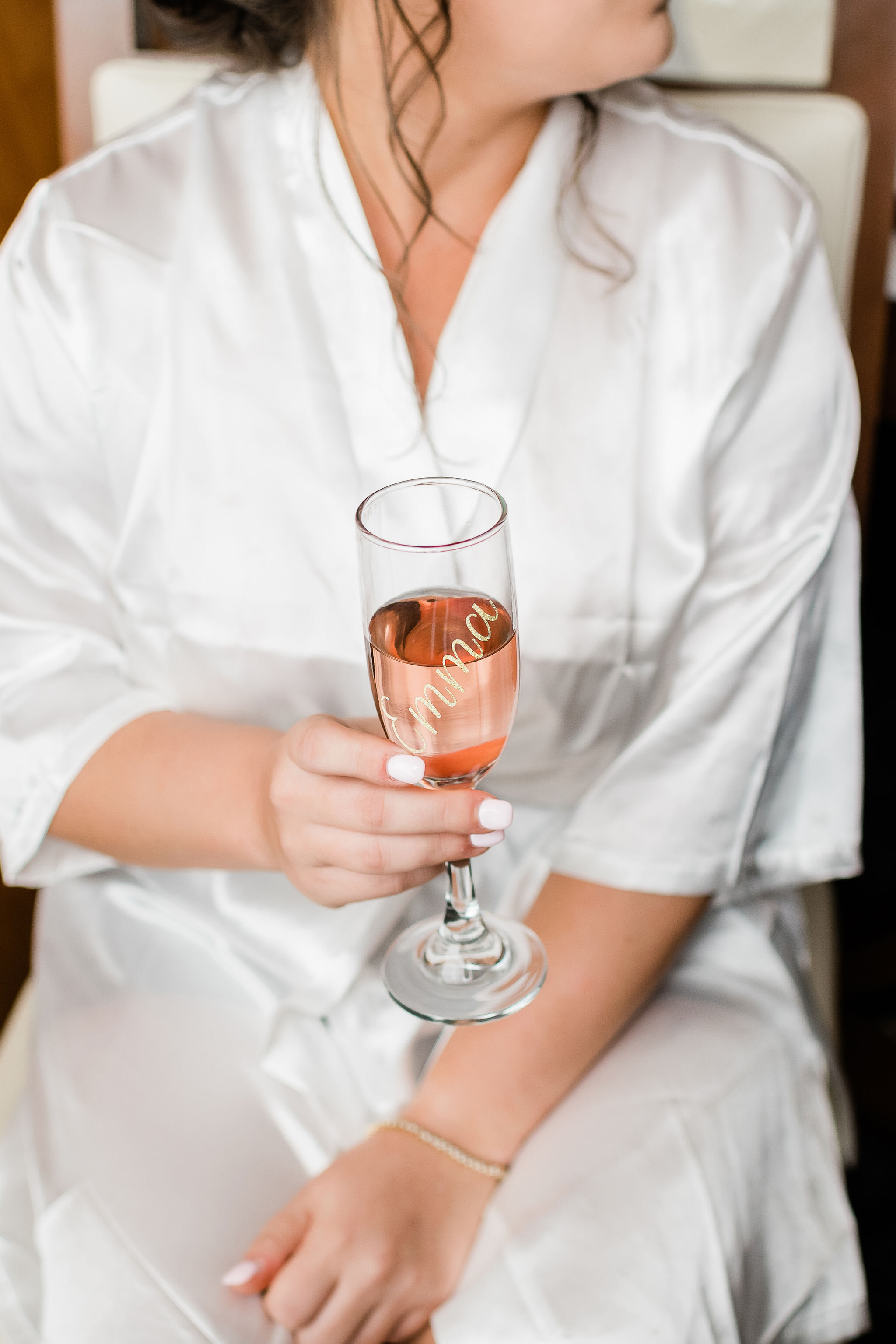 Bride holding a bride champagne glass