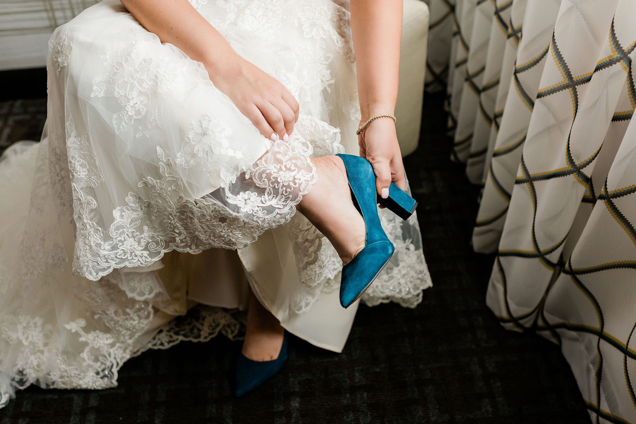 Bride putting her shoe on