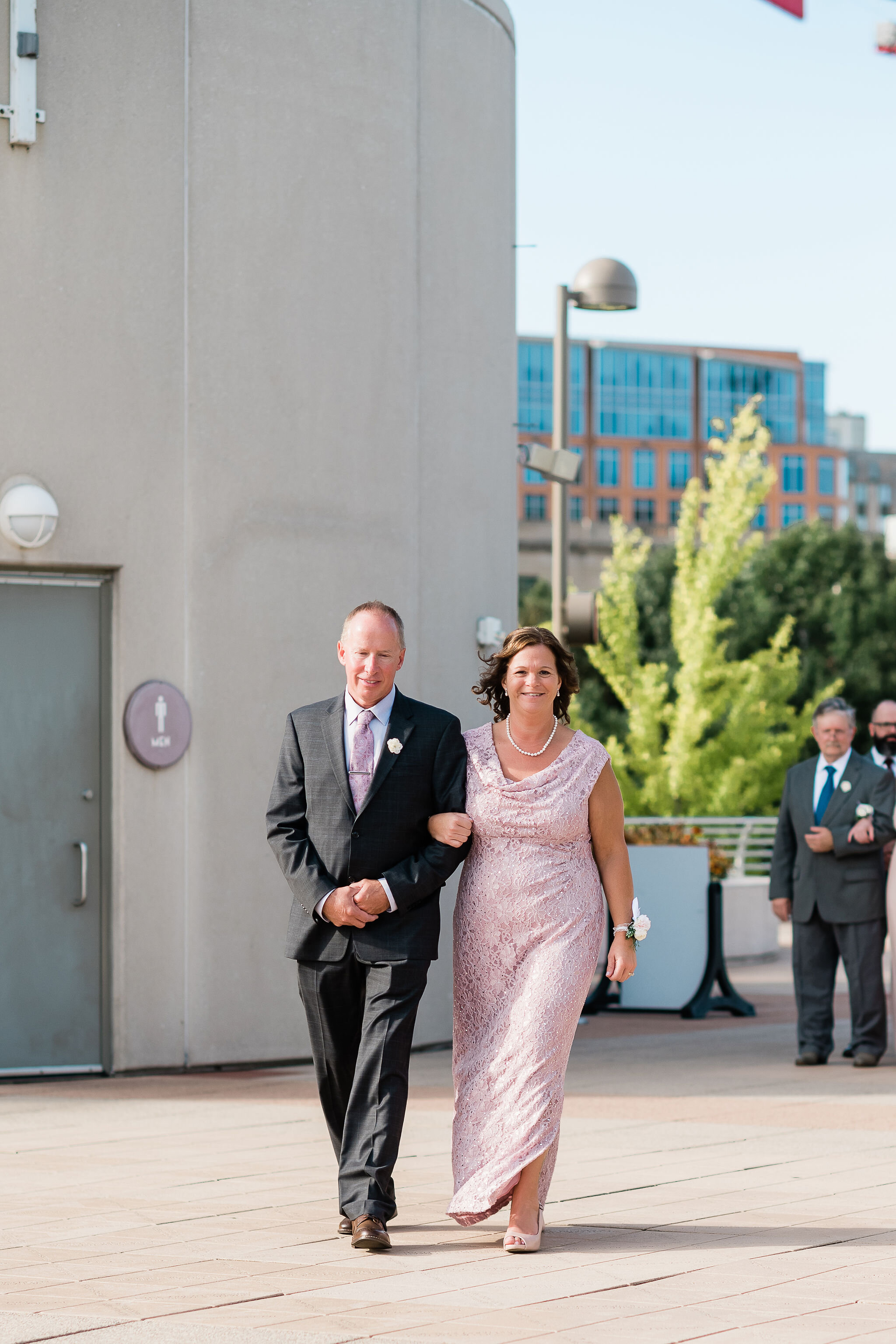 Groom's parents walking down the aisle