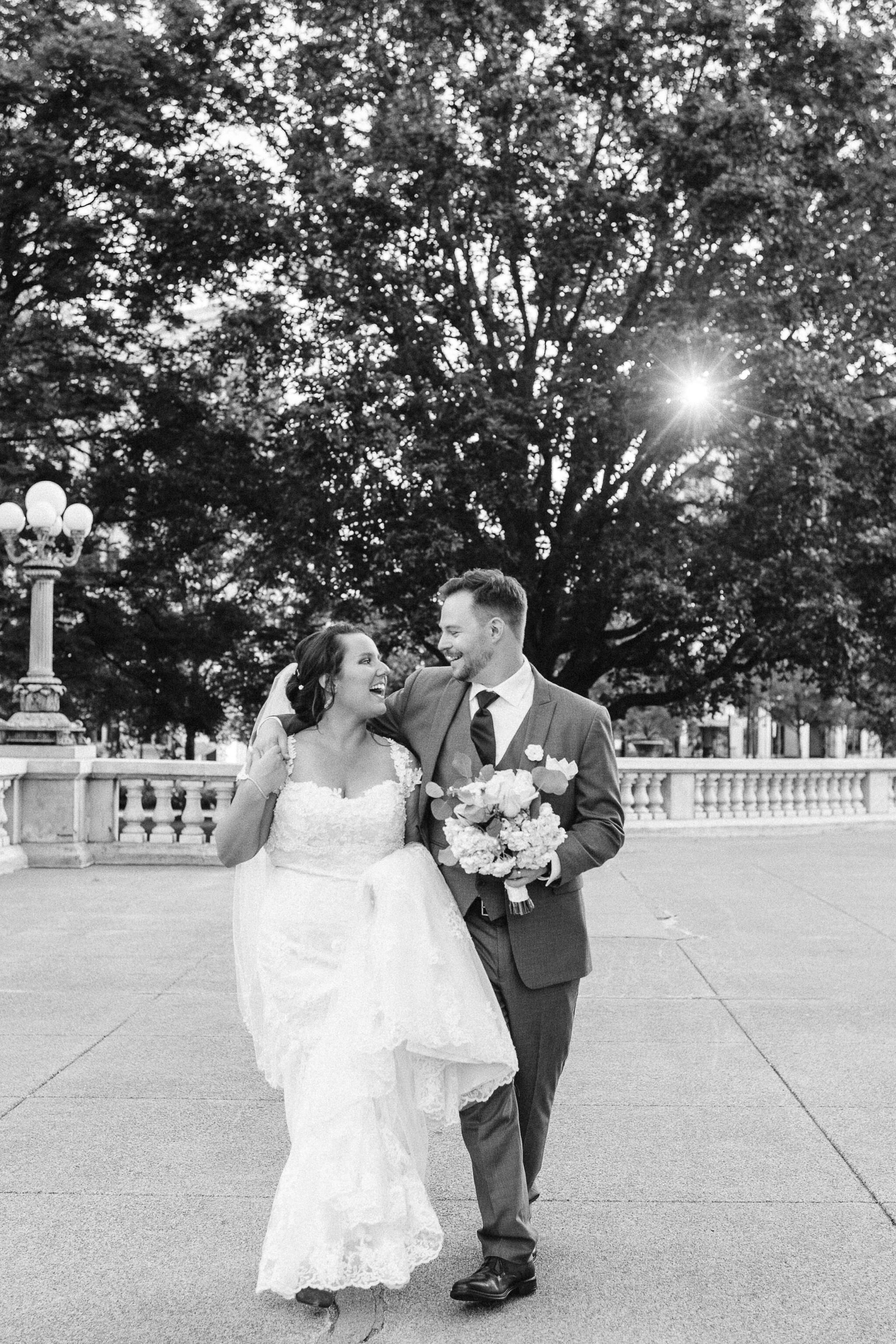 Bride and groom walking and look at each other