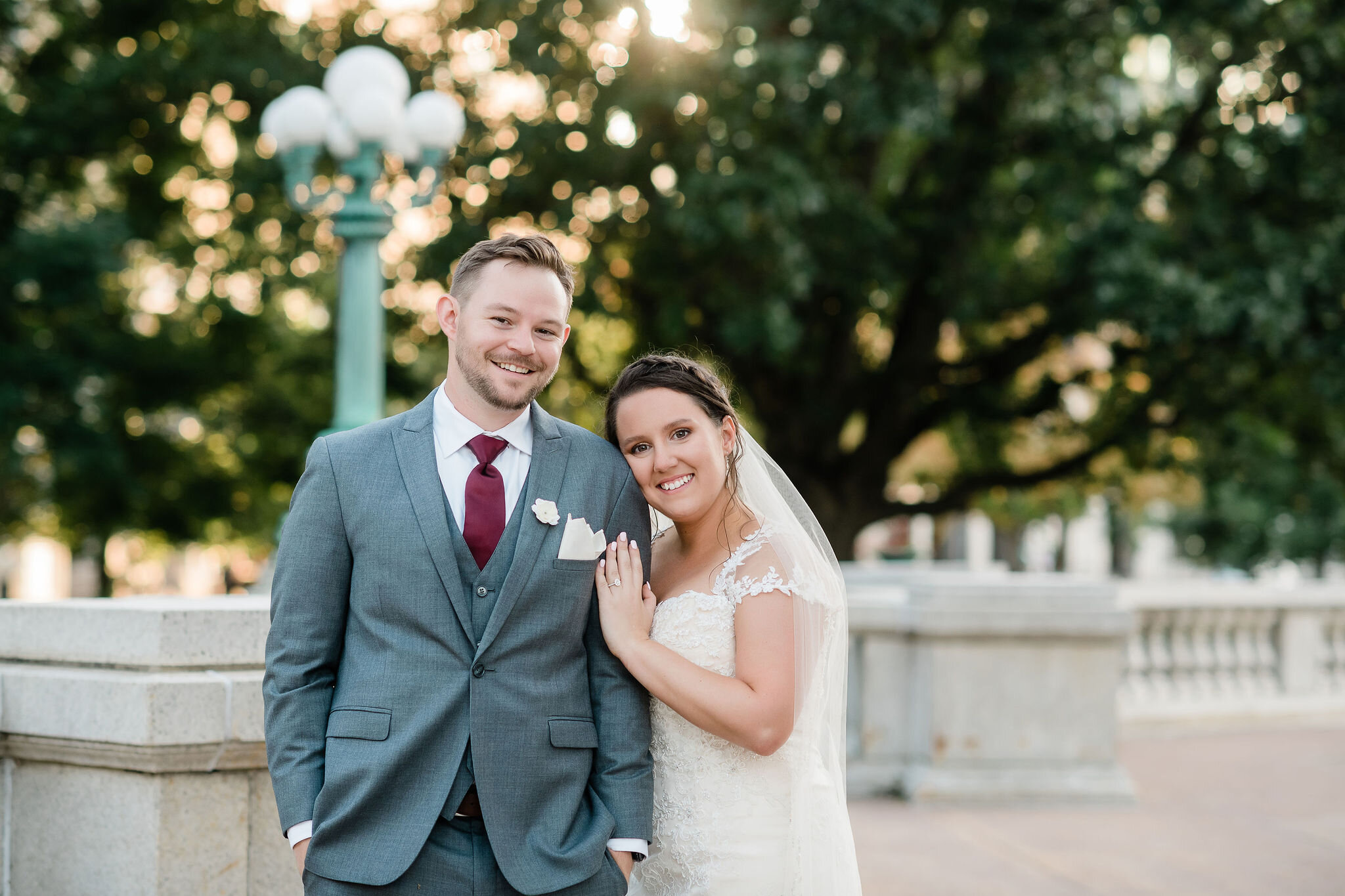 Bride resting her head on grooms shoulder