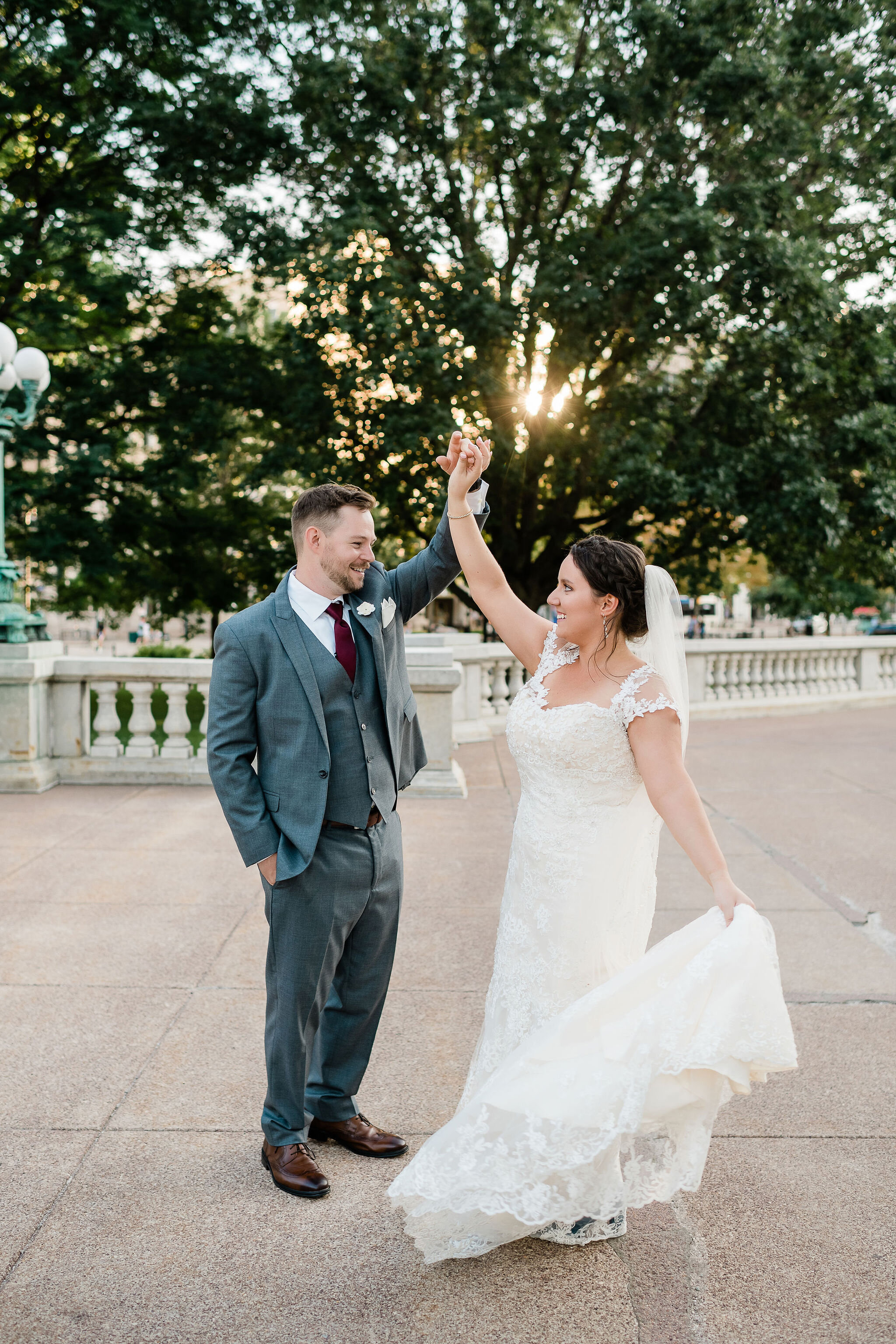 Groom twirling bride around