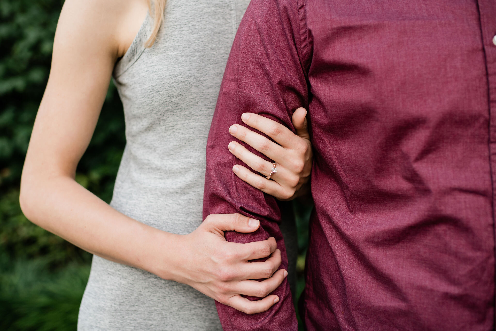 Woman holding her fiancé's arm