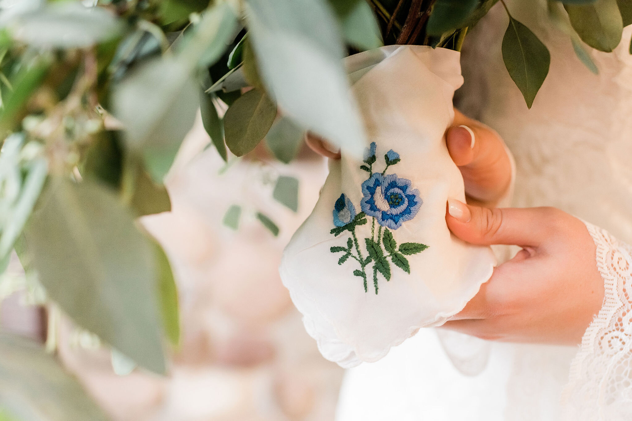 Blue flower handkerchief on bride's bouquet 