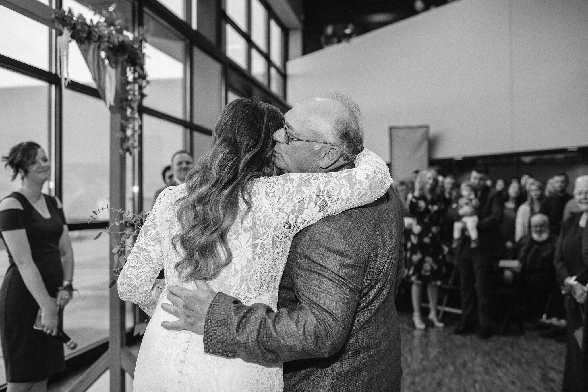 Bride hugging her dad