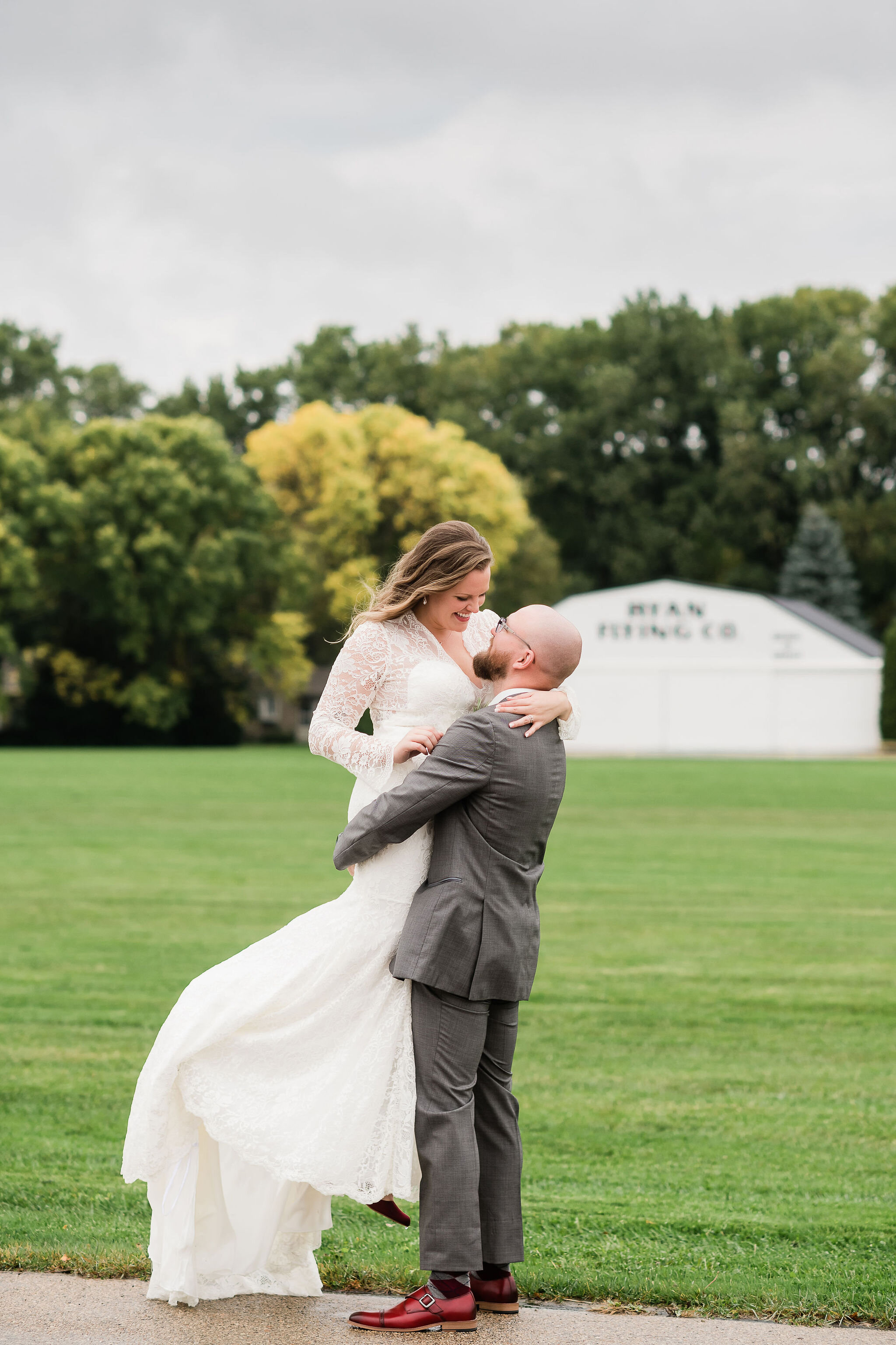 Groom picking bride up