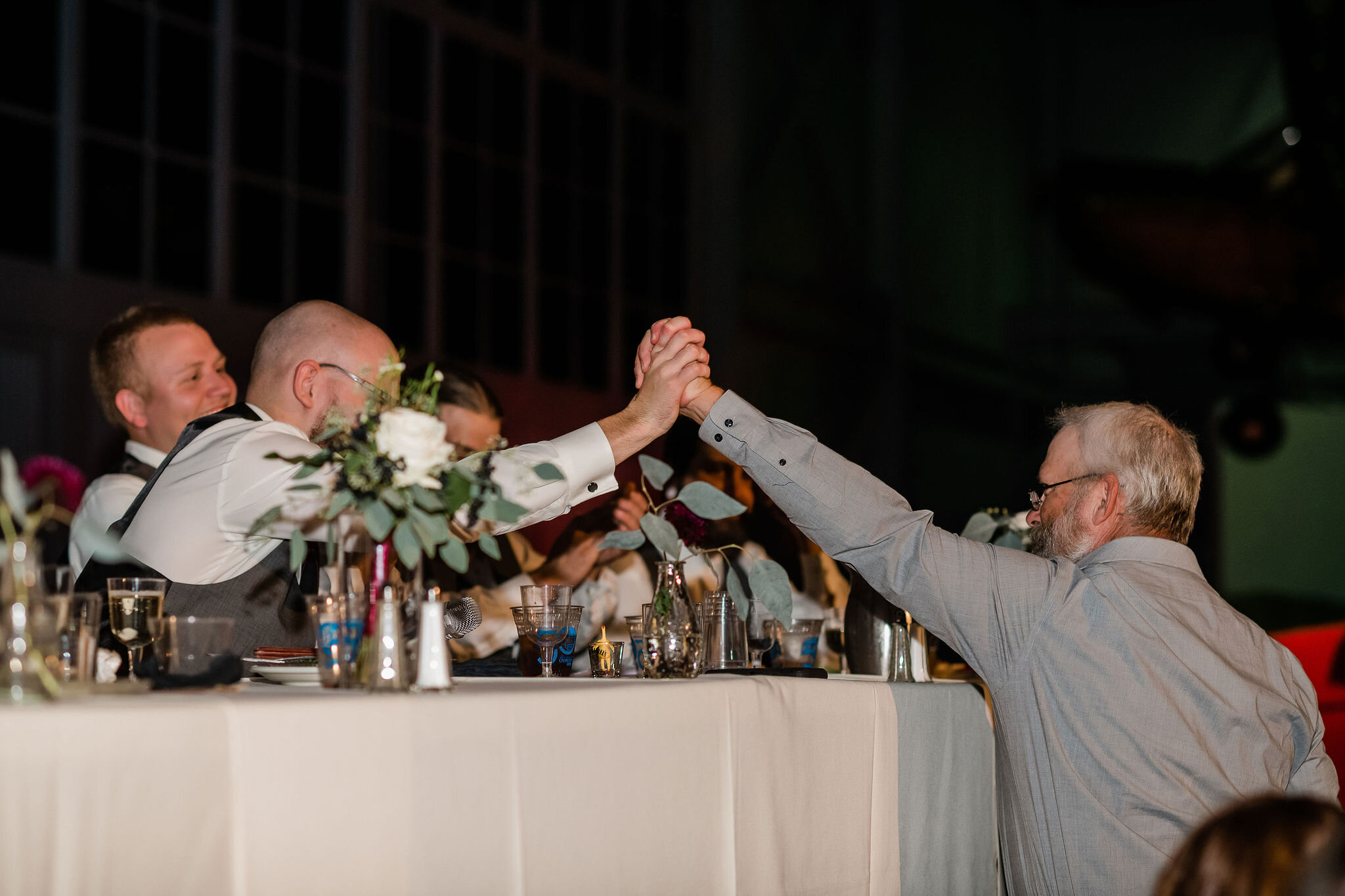 Groom and his father shaking hands
