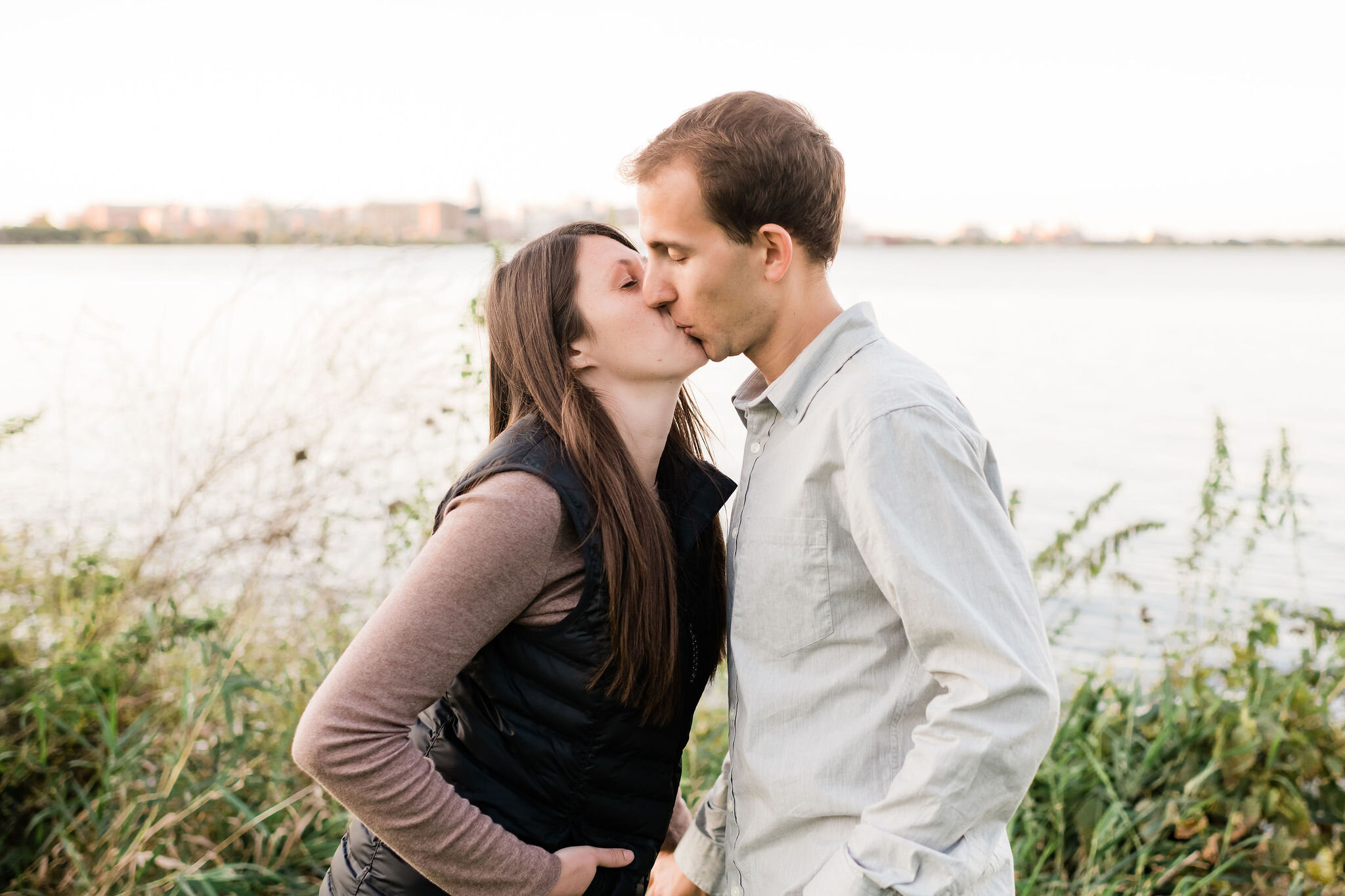 Engaged couple kissing