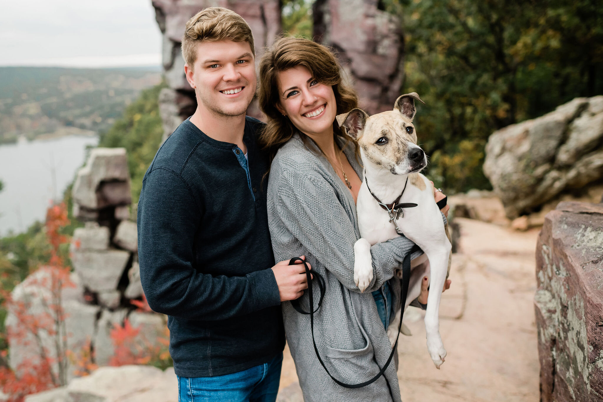 Engaged couple with their dog