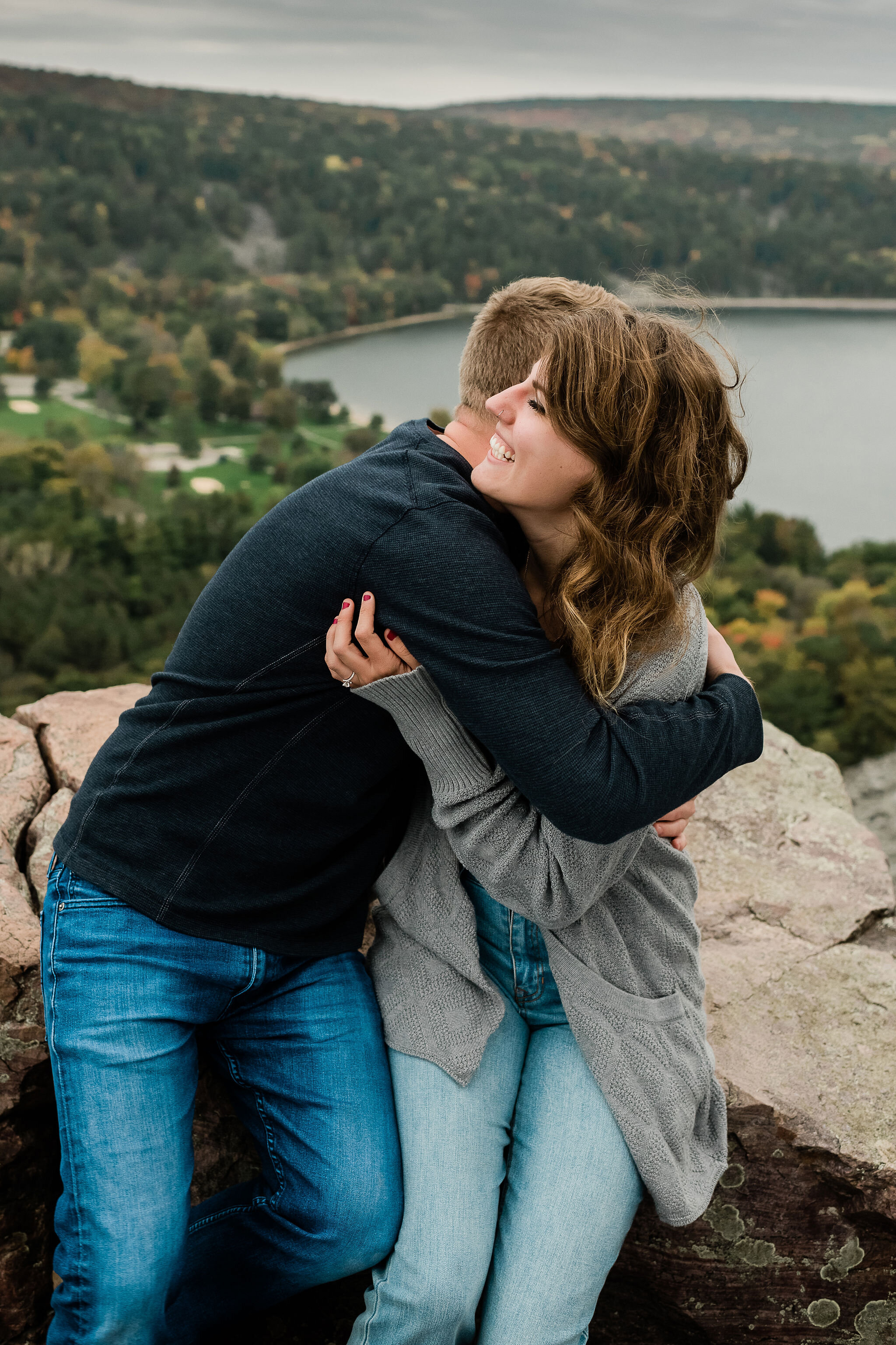 Engaged couple hugging