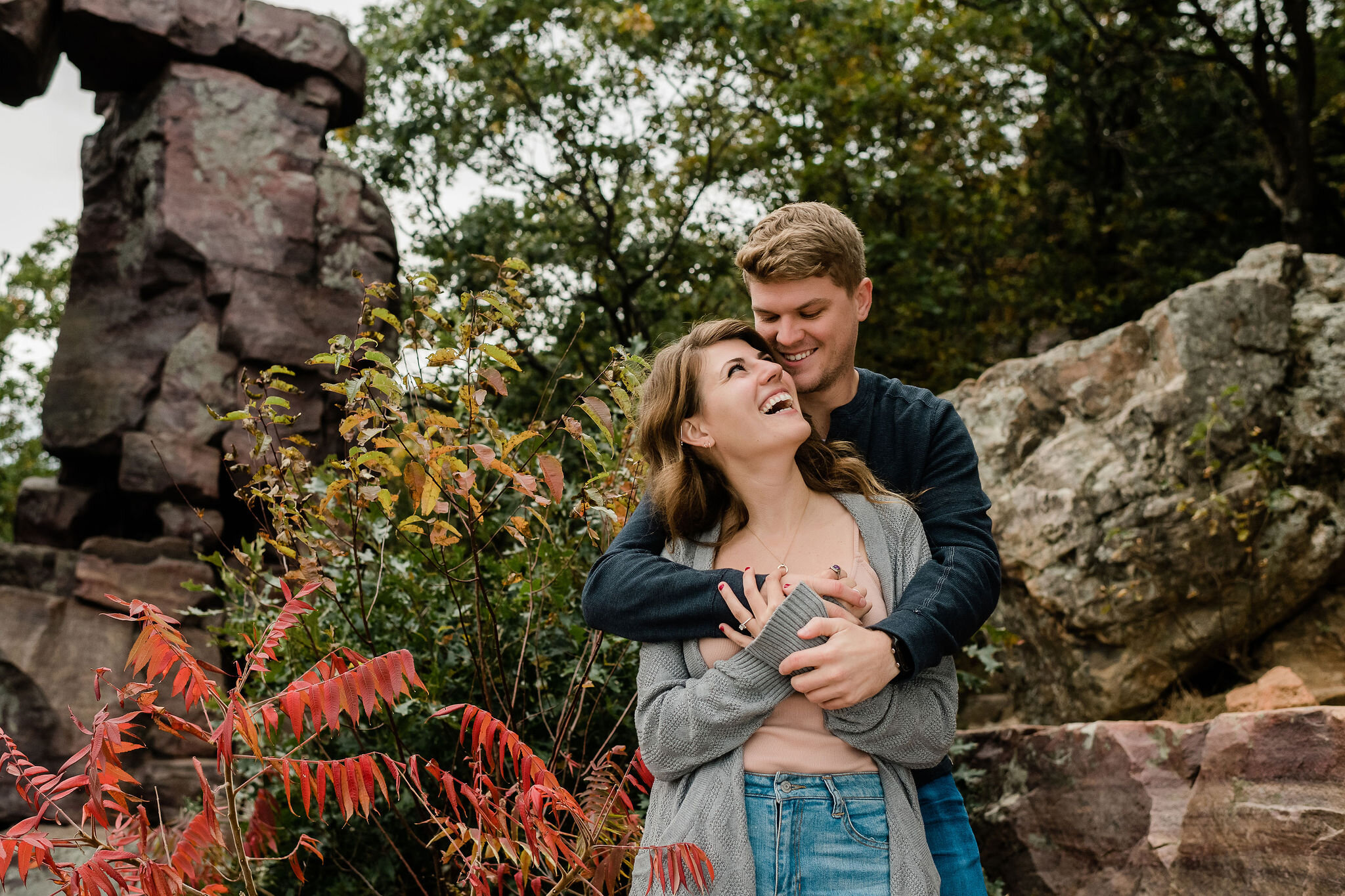 Man hugging his fiancé from behind