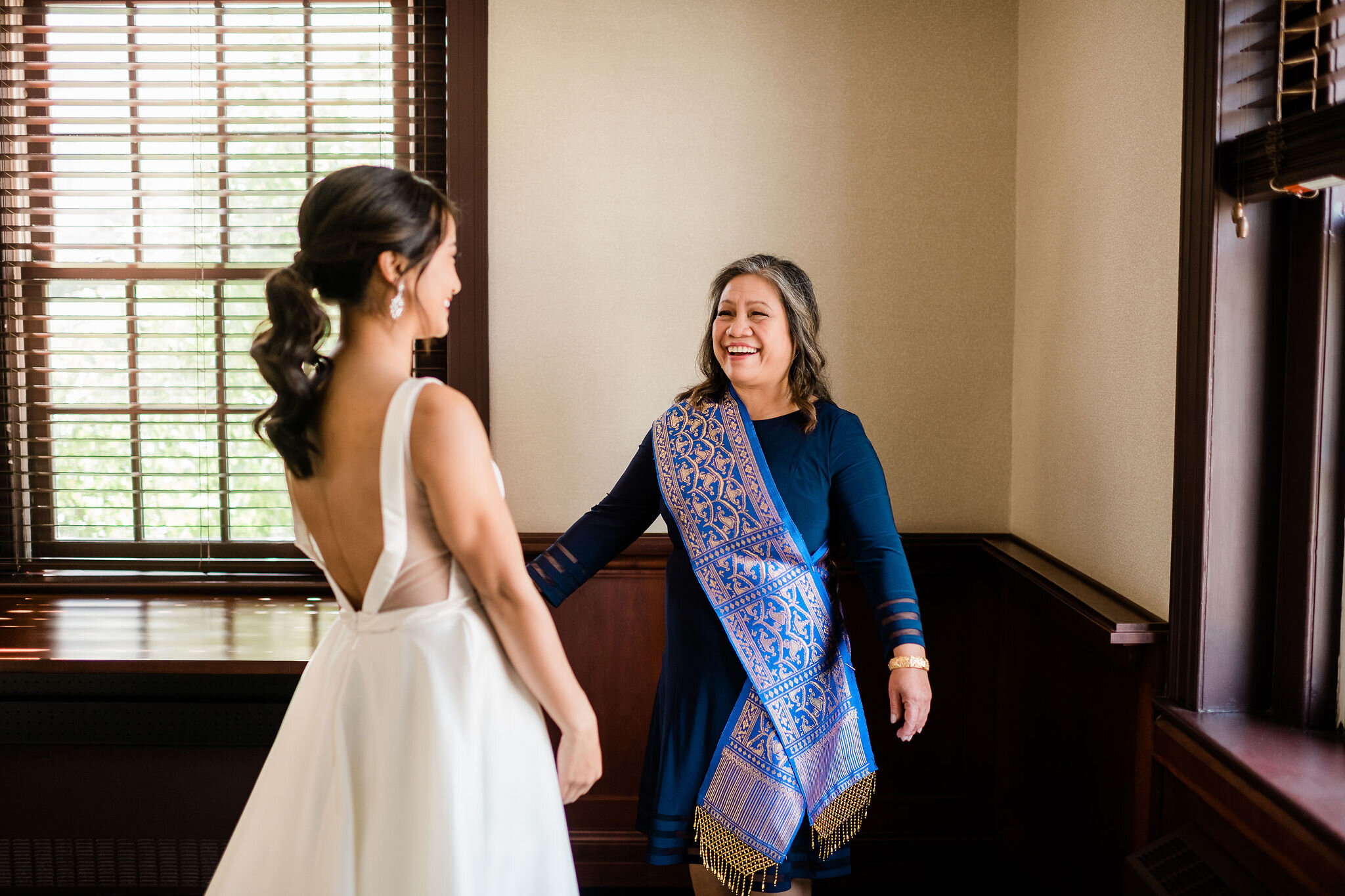 Bride's mom seeing her in her wedding dress