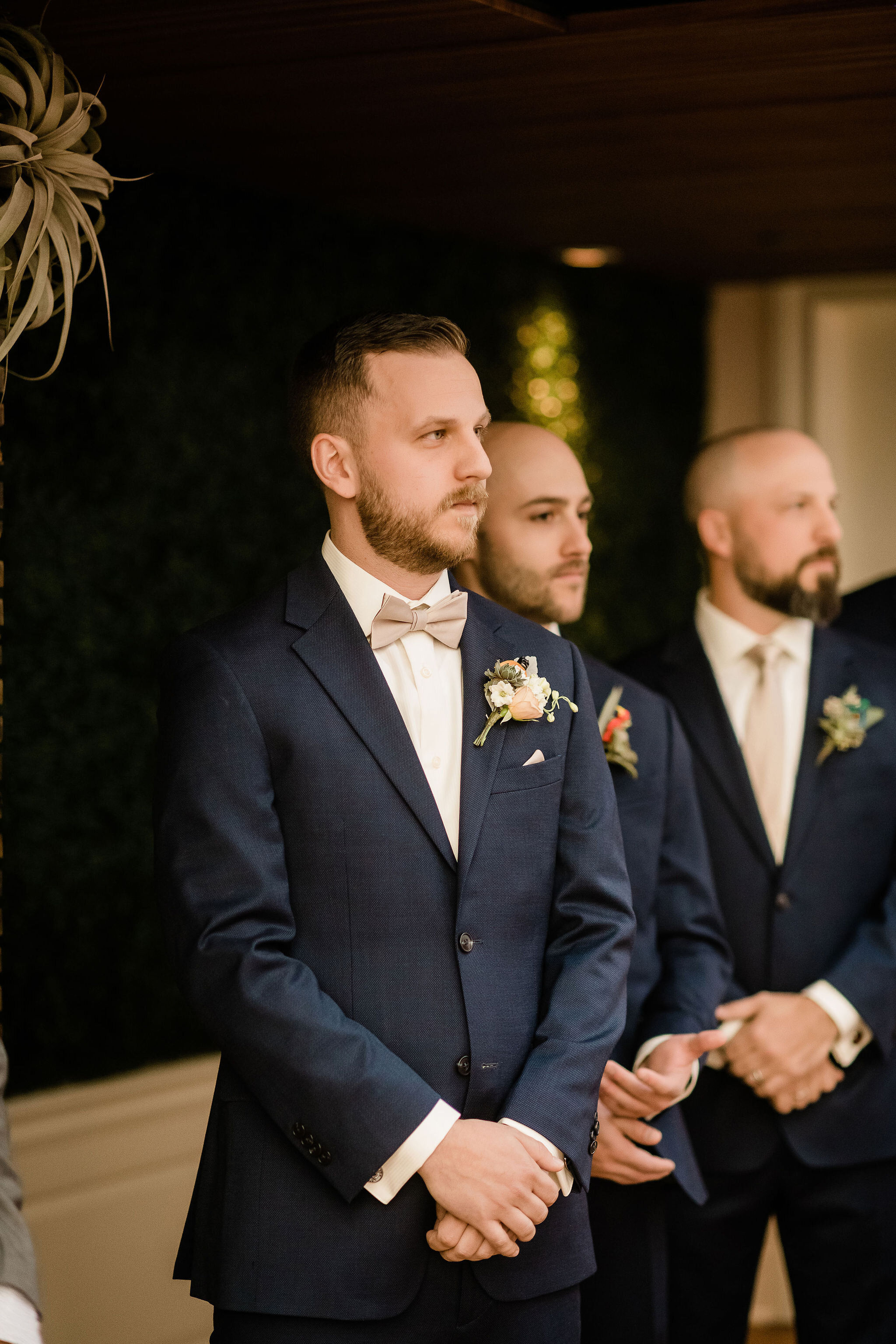 Groom waiting at the alter