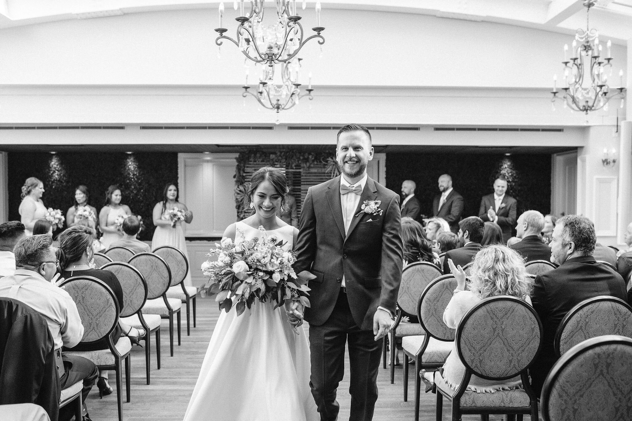 Bride and groom walking down the aisle