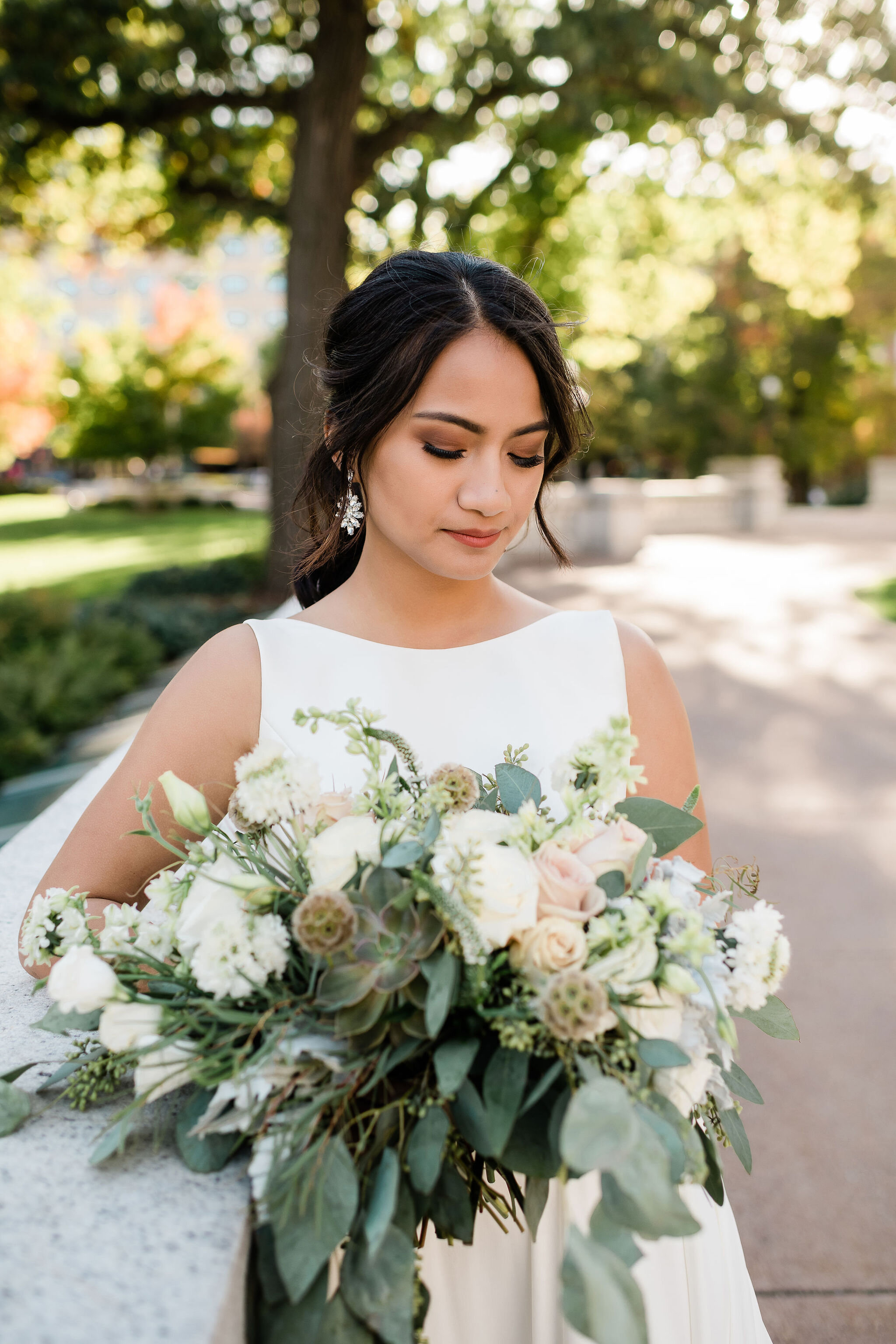 Bride looking at her flowers
